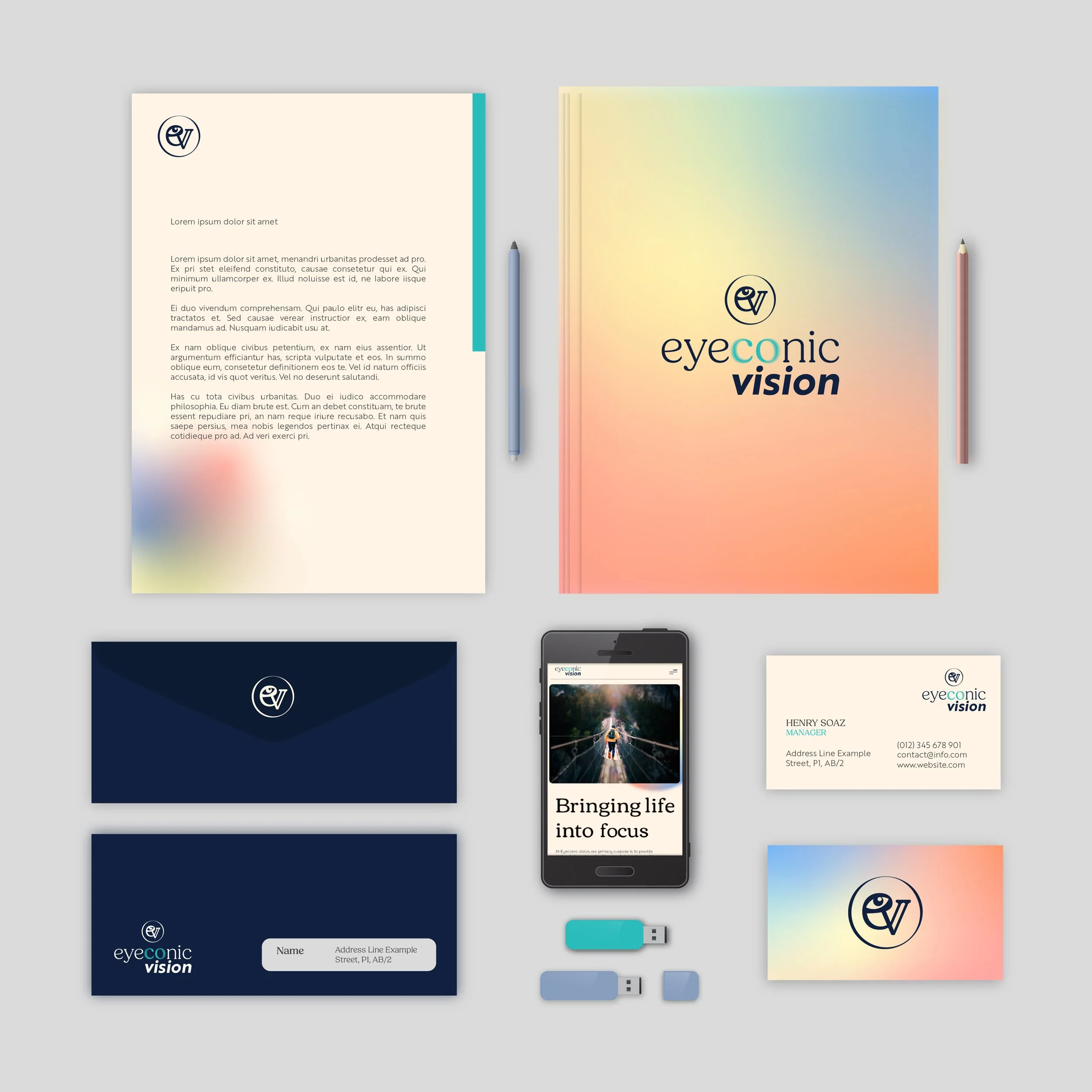 Set of branding materials for Eyeconic Vision including a colorful brochure, two navy blue business cards, a smartphone displaying the company's website, a white contact card, a pastel-colored clipboard with a paper, a pair of pens, and two USB drives.