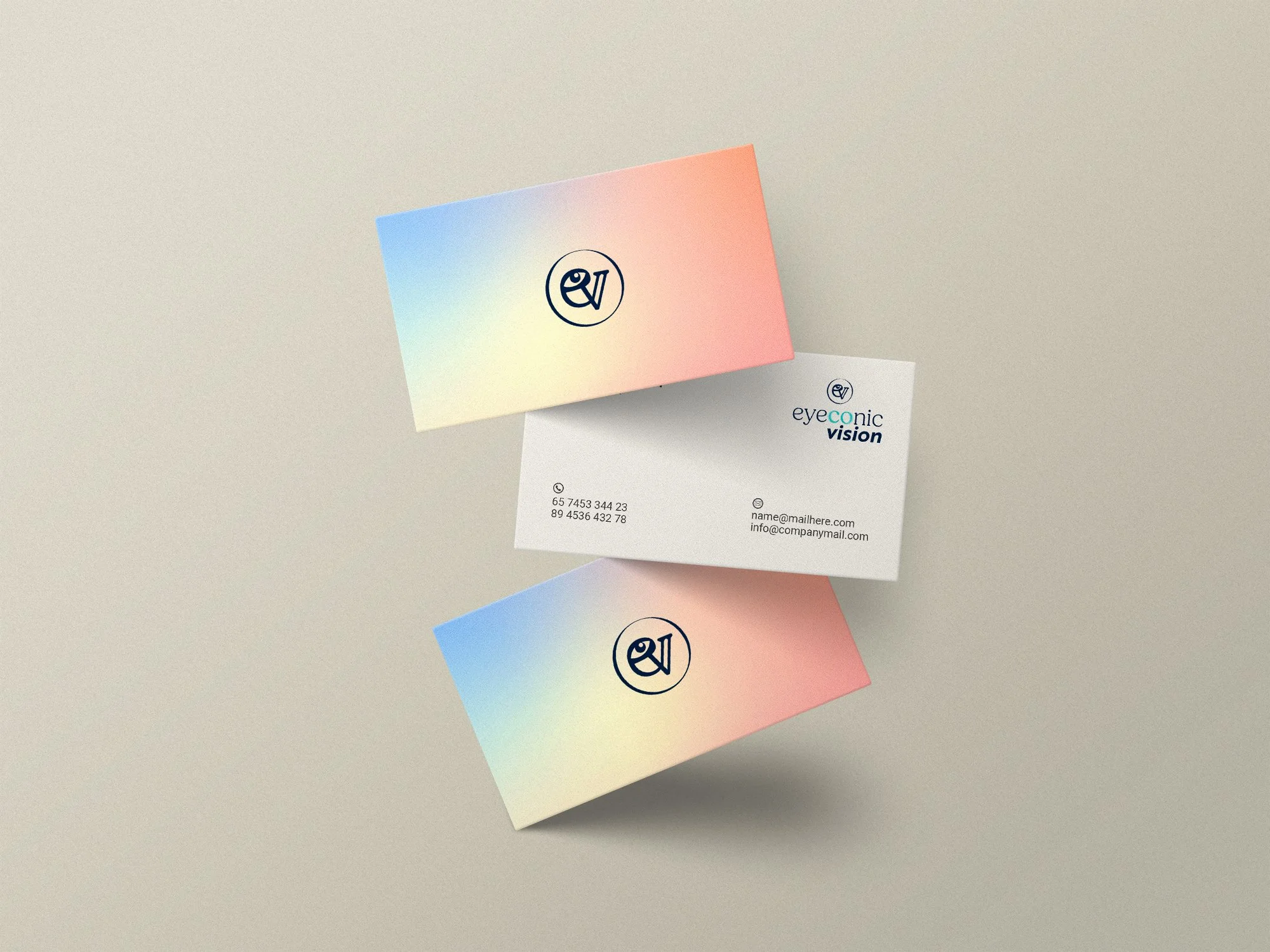 Business cards with a gradient background of pastel colors, featuring a logo with an eye symbol, and contact information including phone number, email, and website.