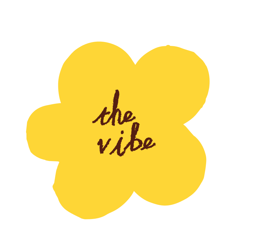 Yellow flower with the words 'the vibe' written in brown inside