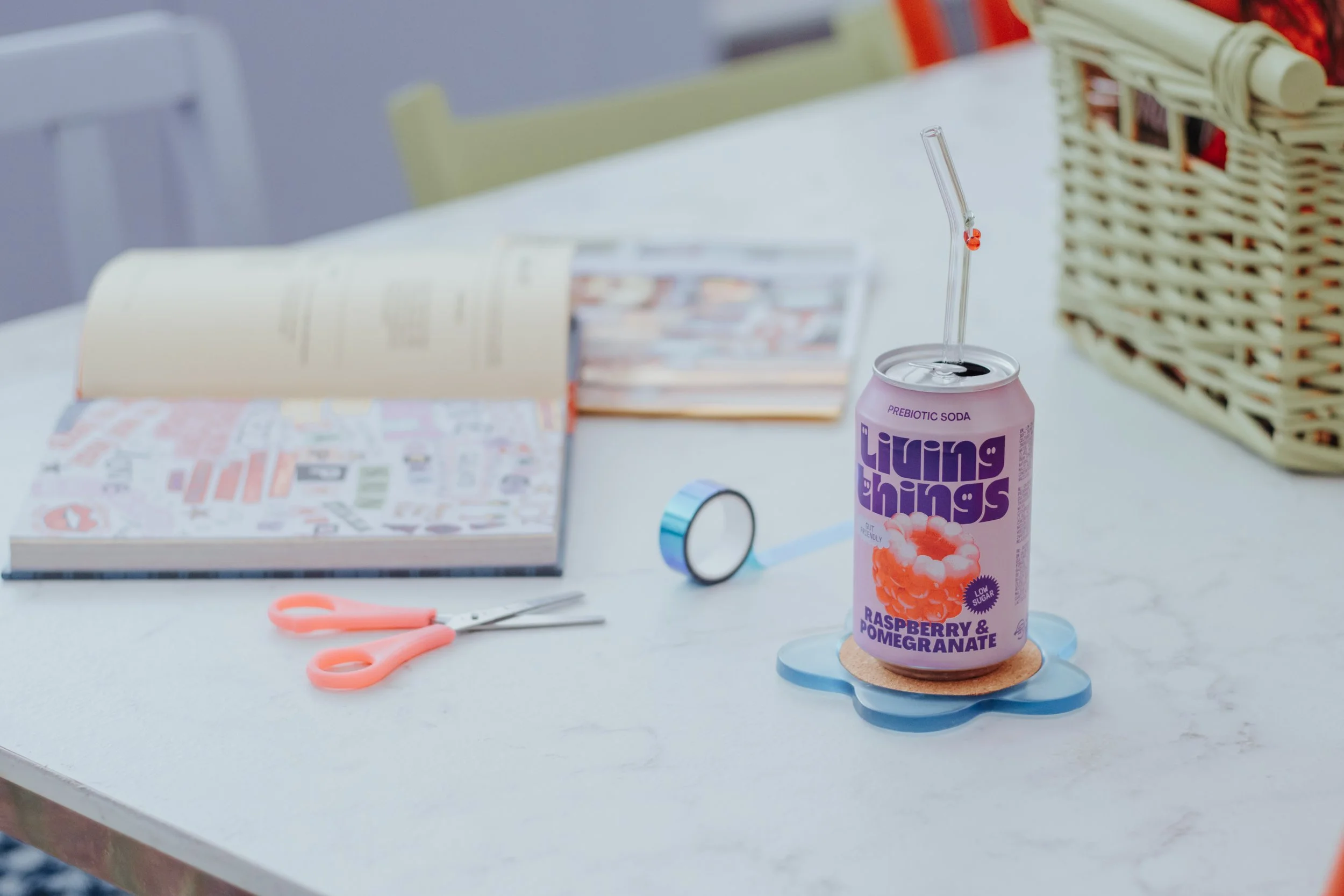 An aesthetic, Atelier set up including: Magazines, Books, Scissors, Washi Tape and a Drinks Can (with a Cherry glass straw)!