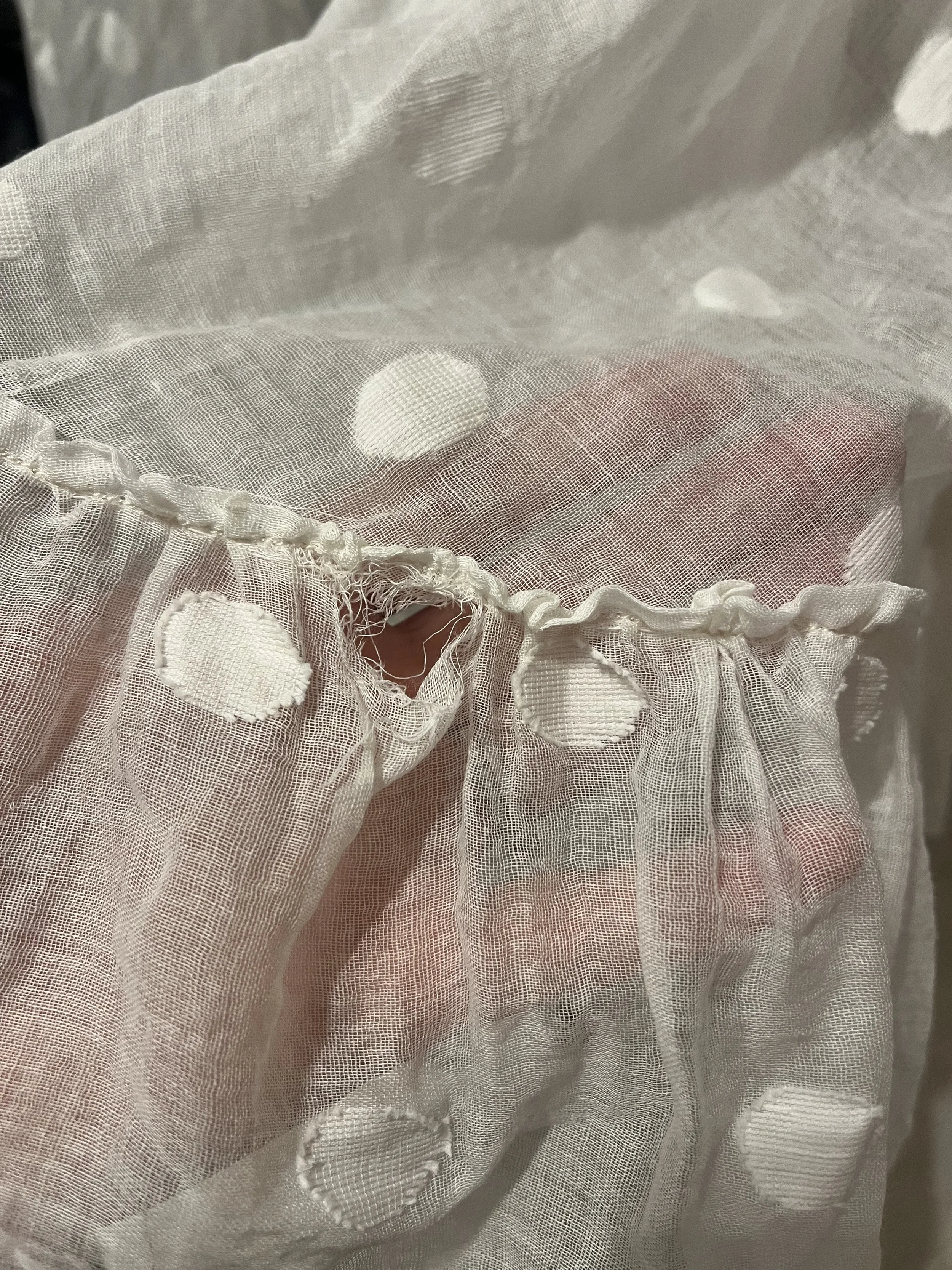 1950s dress showing a hole.webp