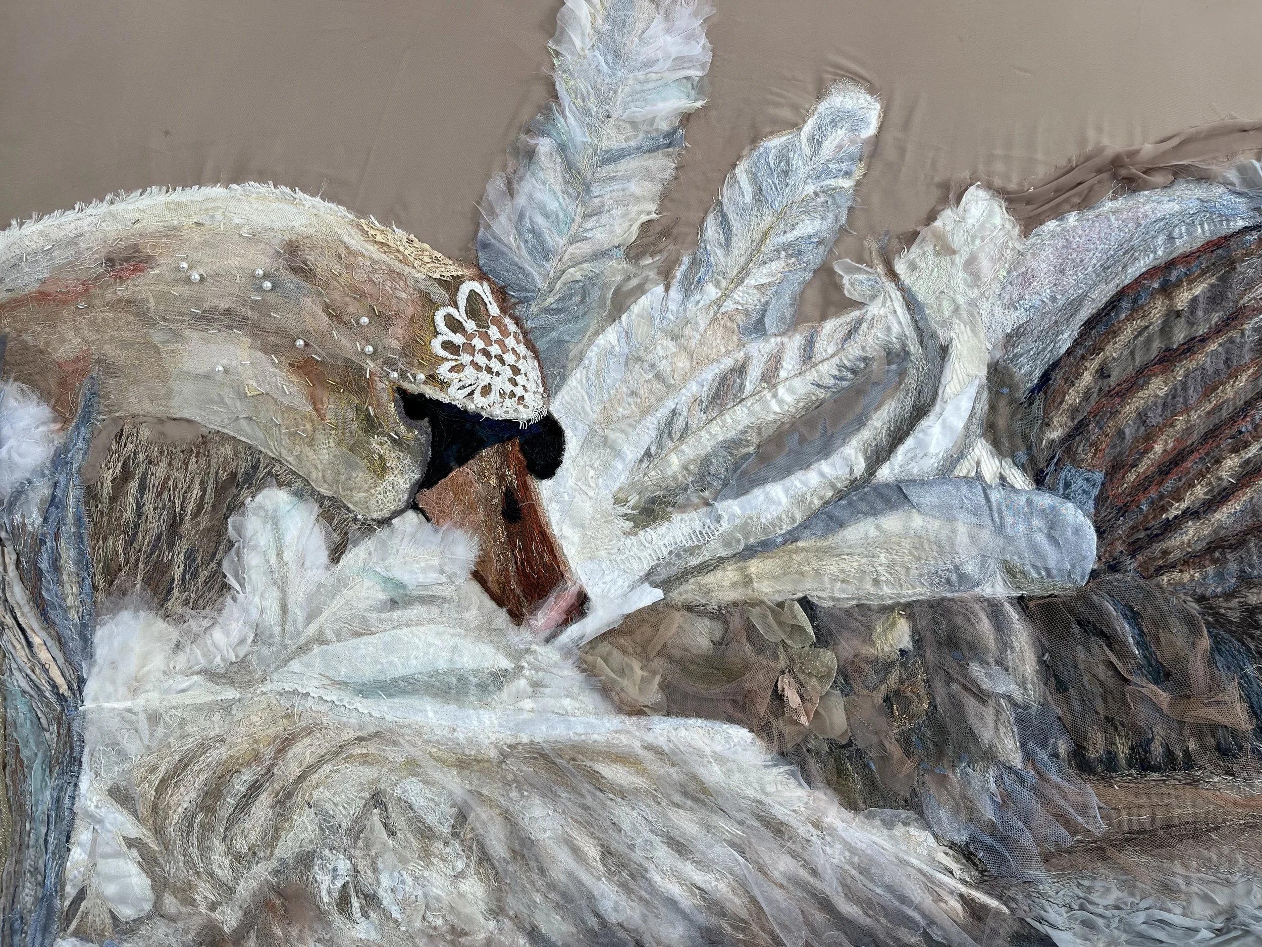 Textile art of a preening swan by Amy Martin