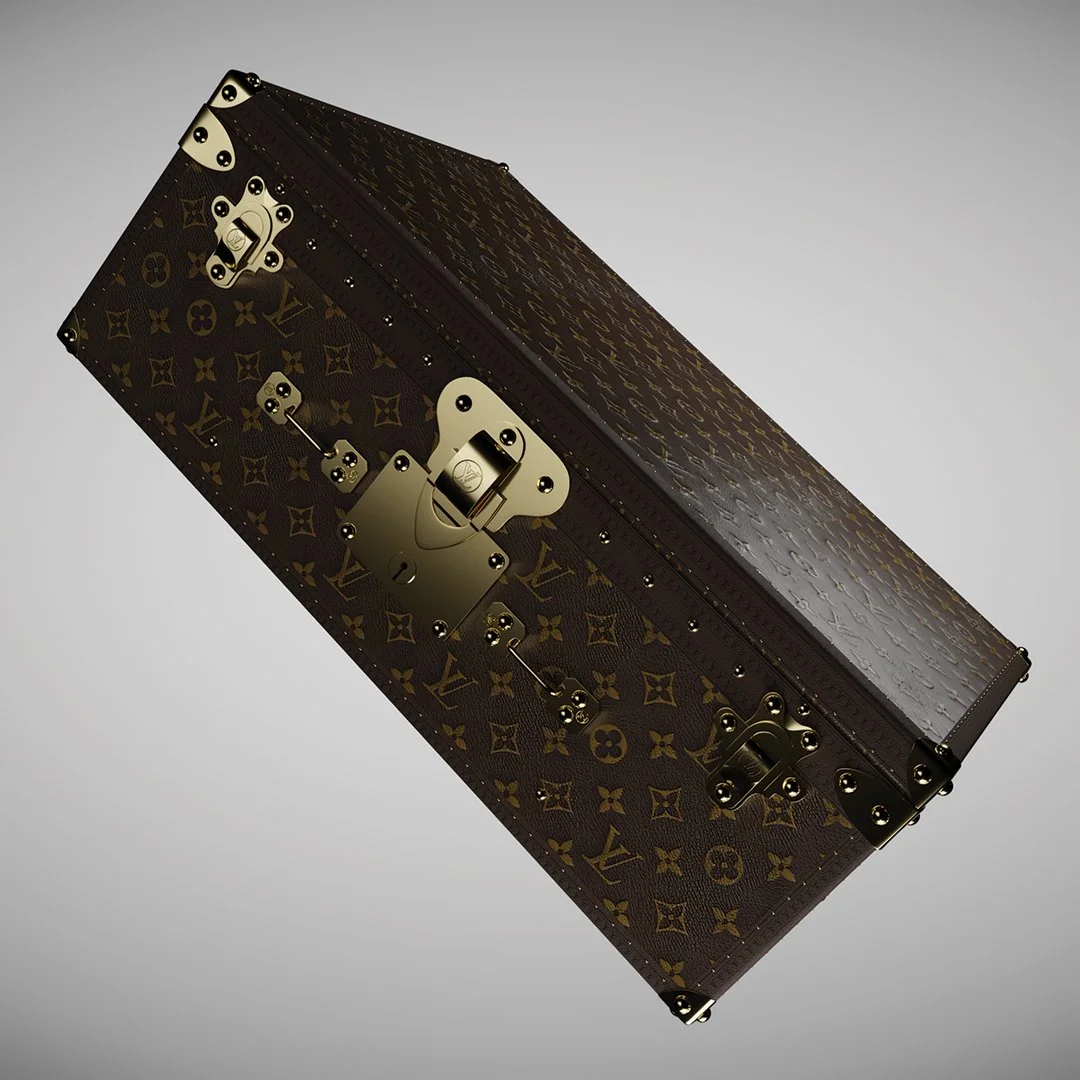 A Louis Vuitton luxury trunk with gold hardware and monogram pattern.