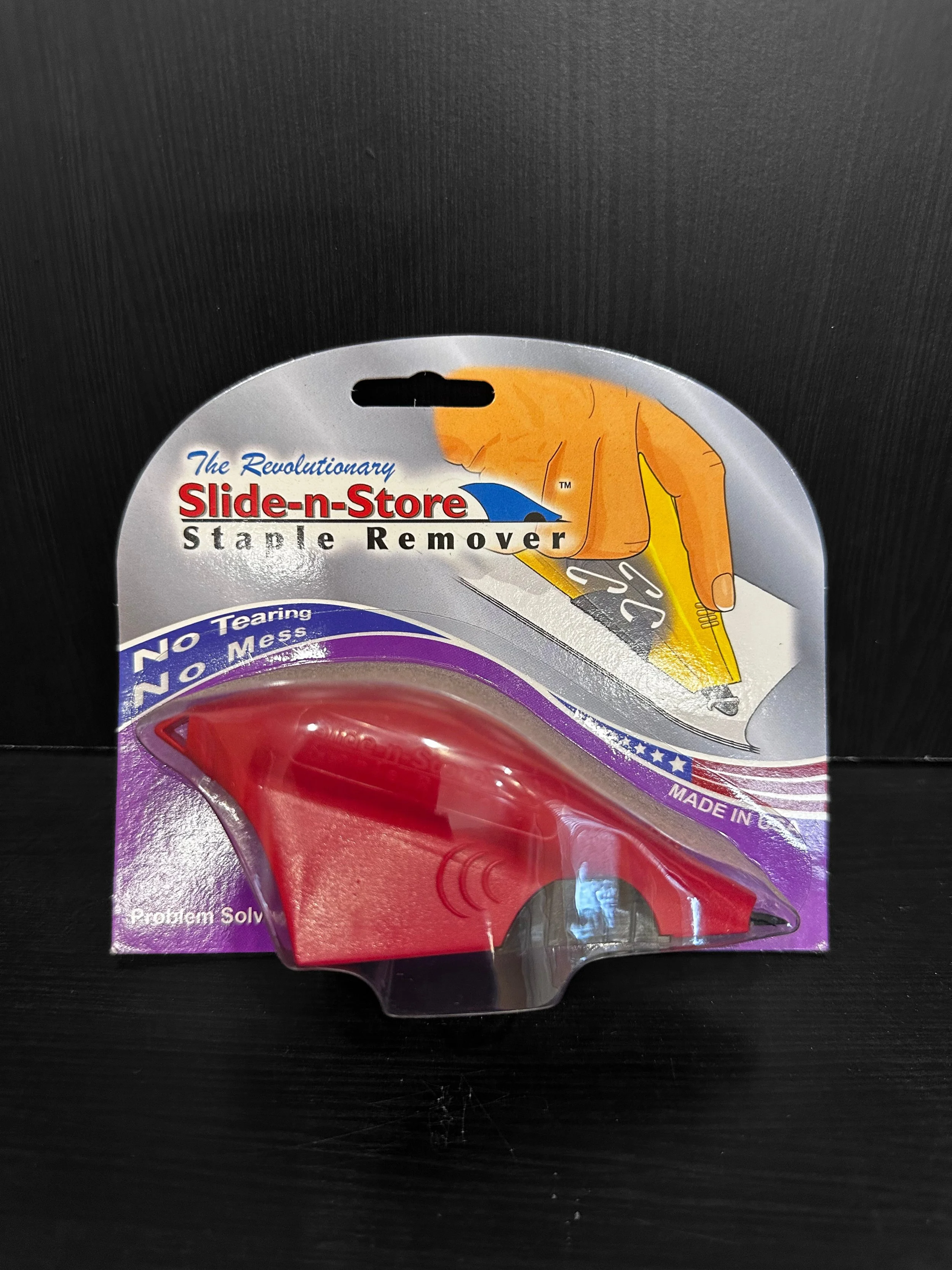 Scenic landscape with a lake surrounded by green hills and mountains under a cloudy sky.