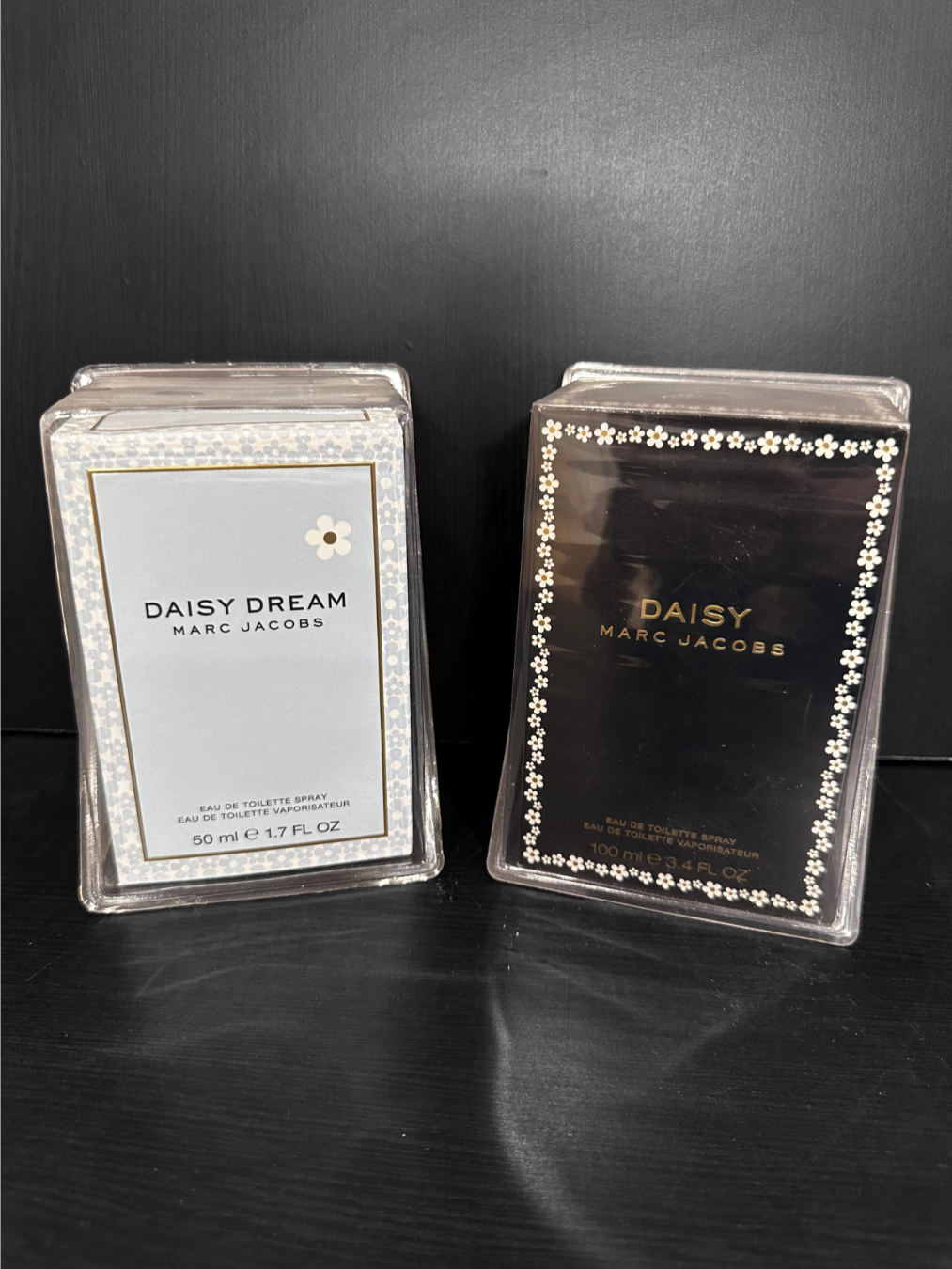 Scenic view of a mountain landscape with snow-capped peaks, a hillside with a building, and a cloudy sky.