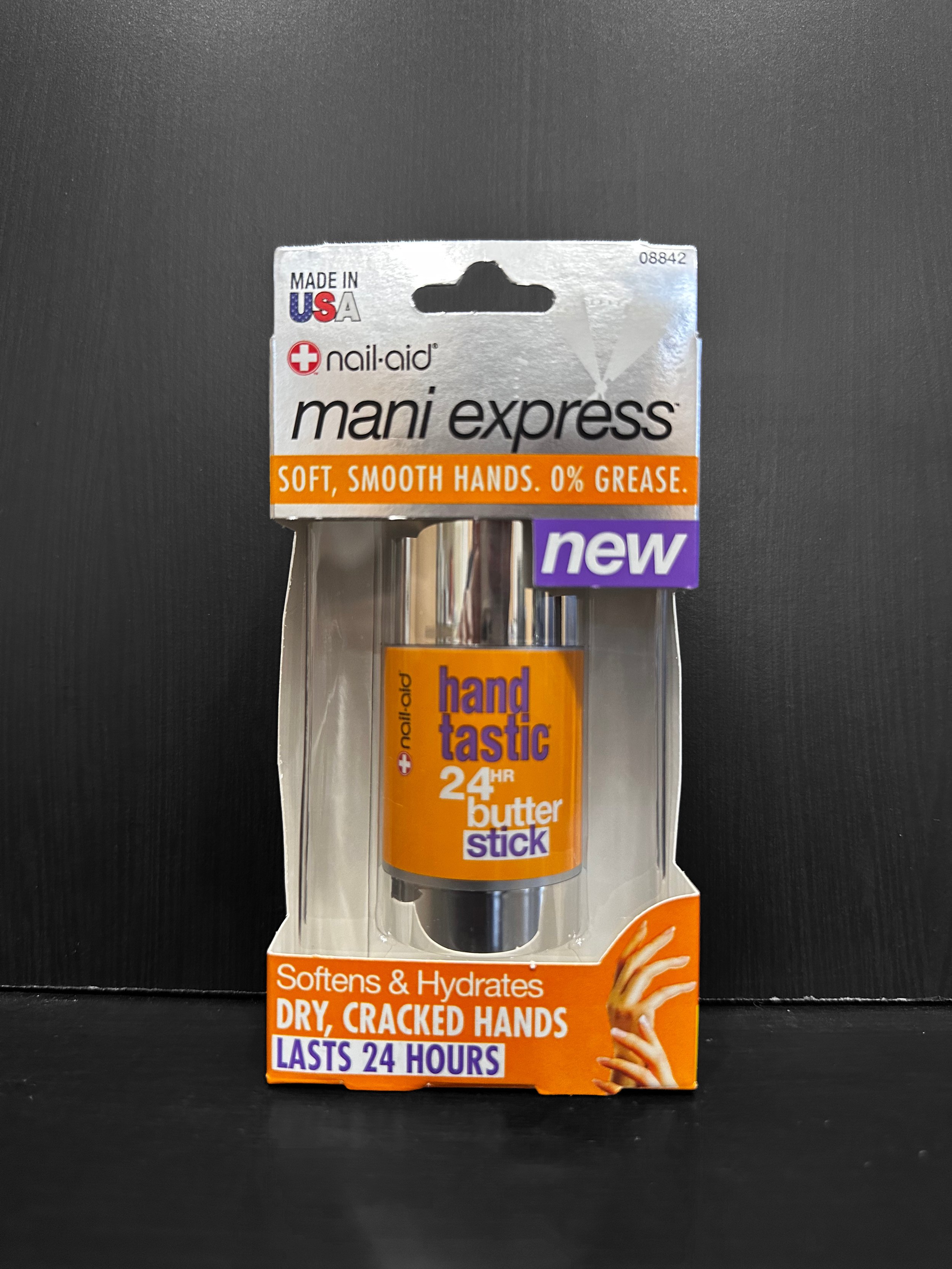 Close-up of a makeup compact with a mirror and eyeshadow, and a Prestige makeup pencil, part of a promotional display.