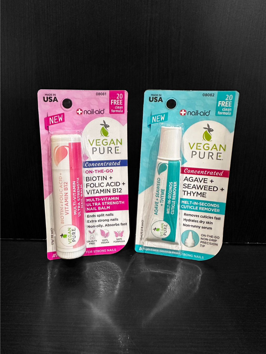 A small house on a hill with snow-capped mountains in the background and a cloudy sky overhead.