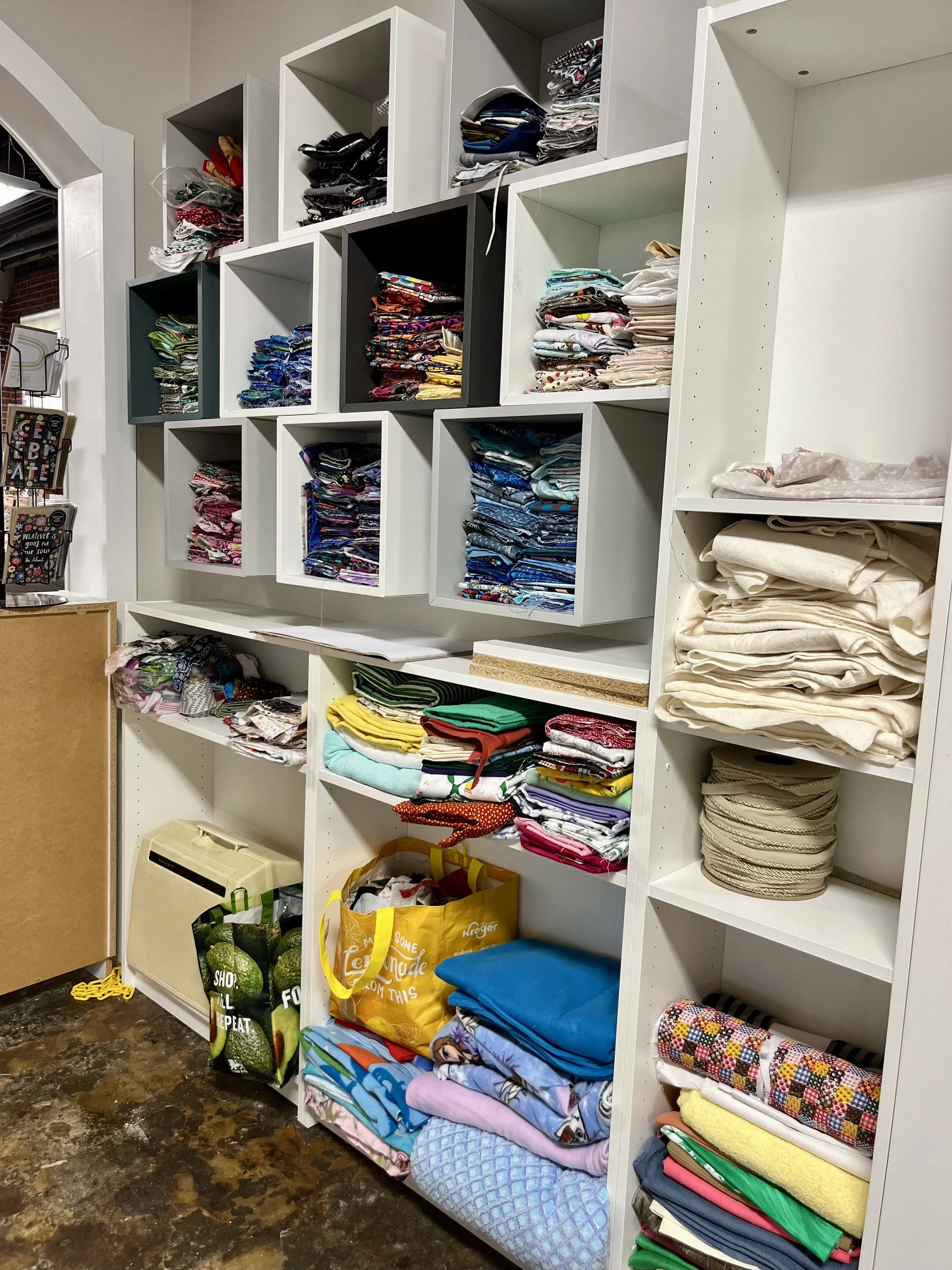 Shelves of folded fabric