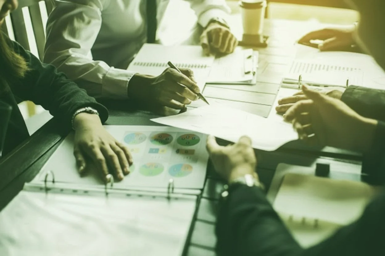 Hands on Table Green Overlay.jpg