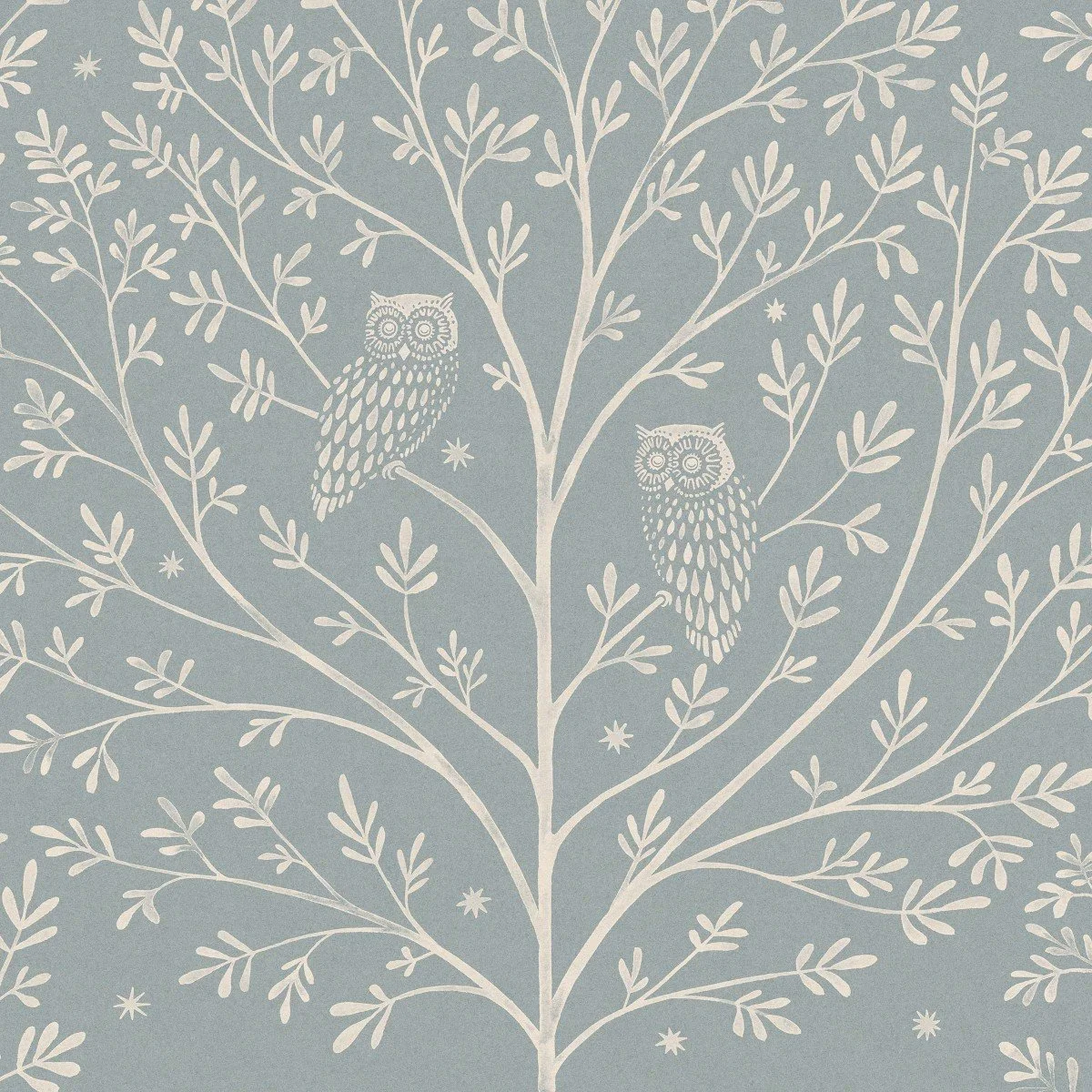 Pattern of white owls and branches with leaves on a blue background.