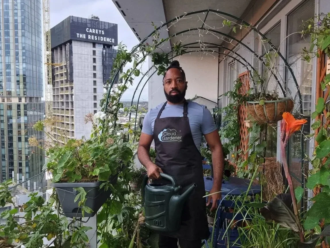 Jason - the Cloud Gardener, on his garden balcony in Manchester city centre