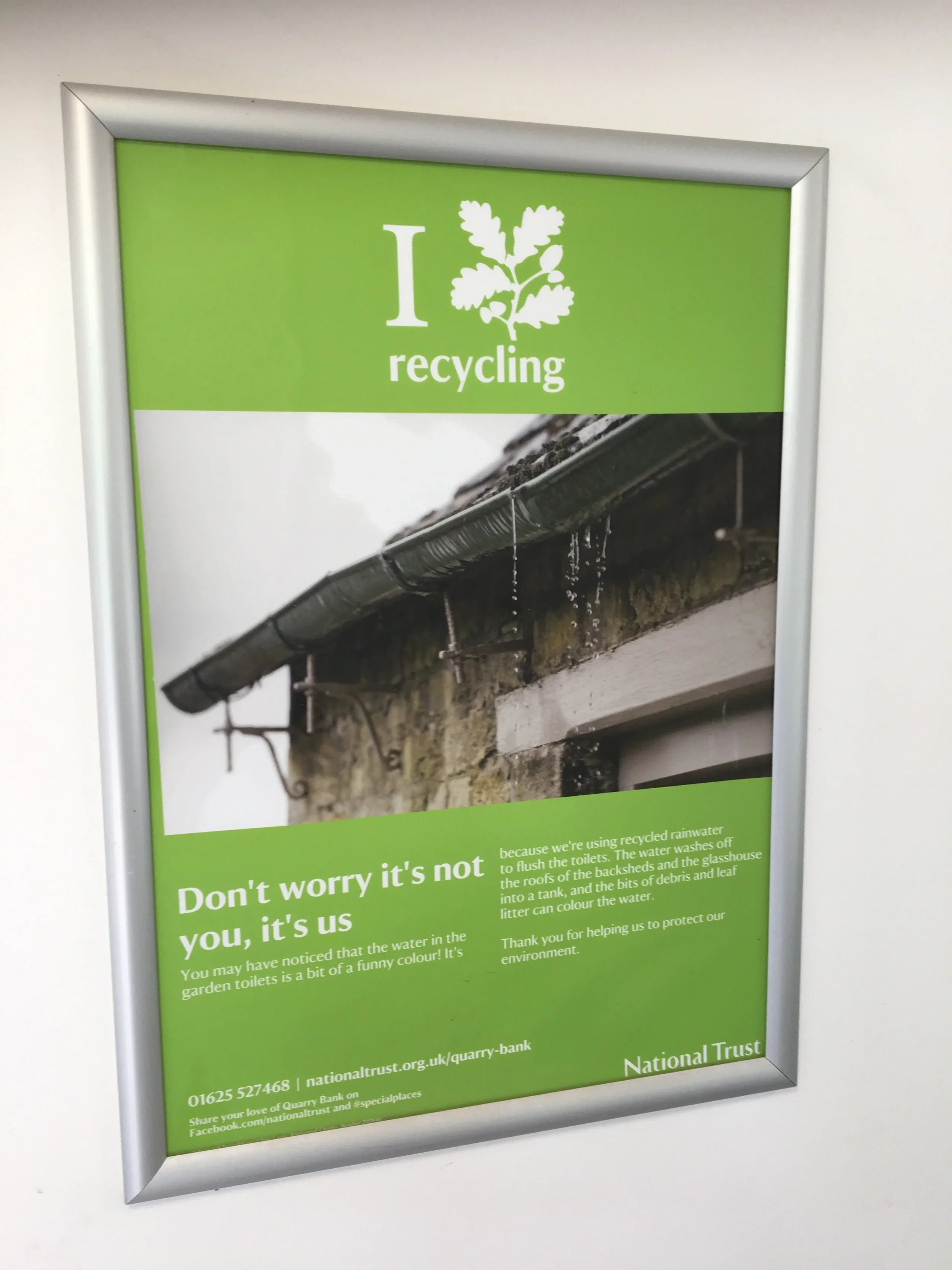 Poster in toilet cubicle at Quarry Bank Mill explaining the use of rainwater for flushing