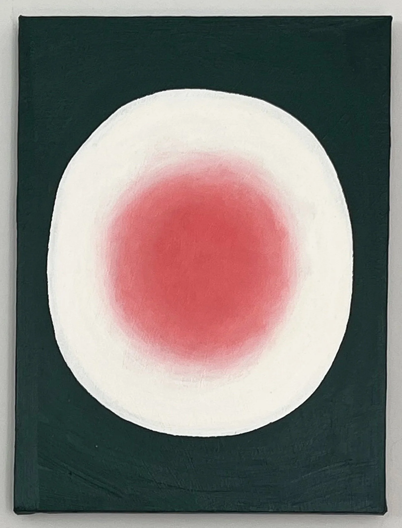 Abstract painting with a white circle containing a red gradient center on a dark green background.