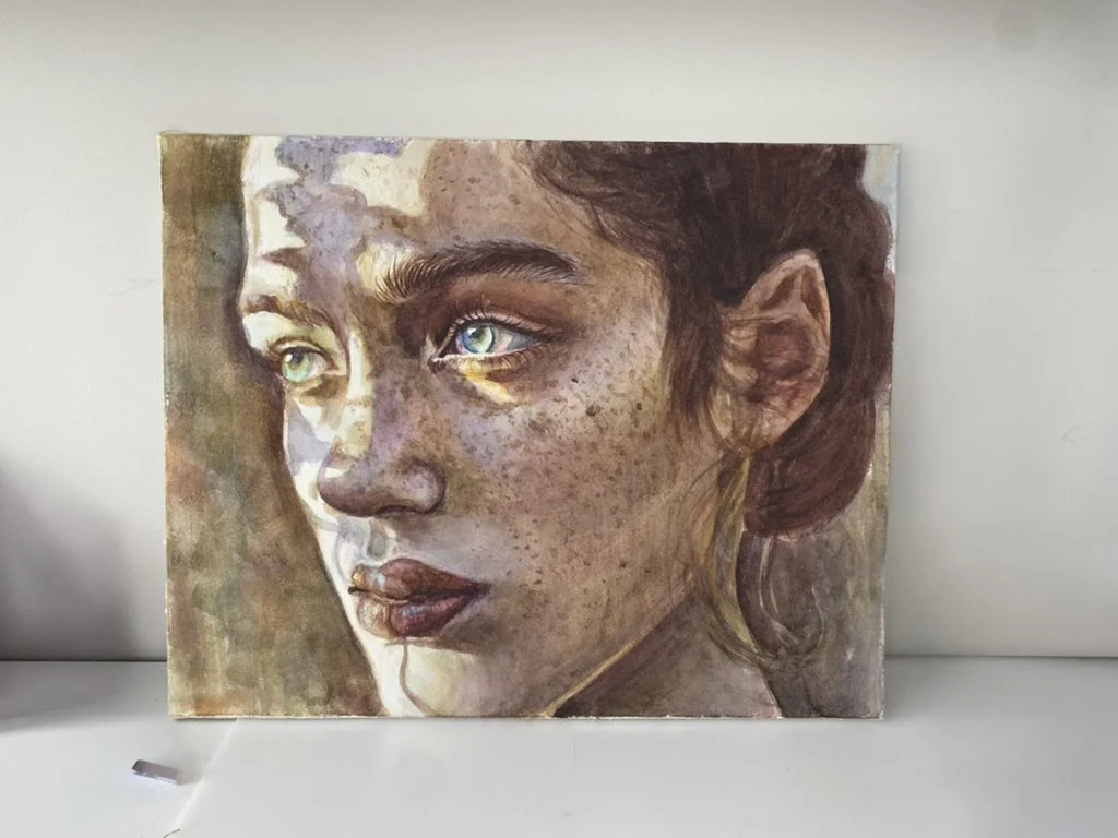 Painting of a woman with light brown skin, blue eyes, freckles, and auburn hair, looking to the side.