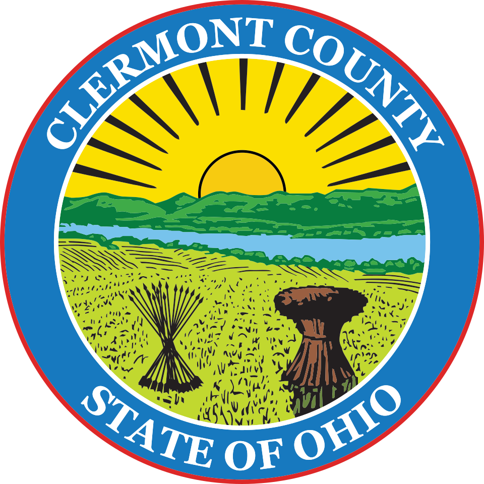 Seal of Clermont County, Ohio, featuring a sunrise over green hills, a river, a sheaf of wheat, and a tree stump.