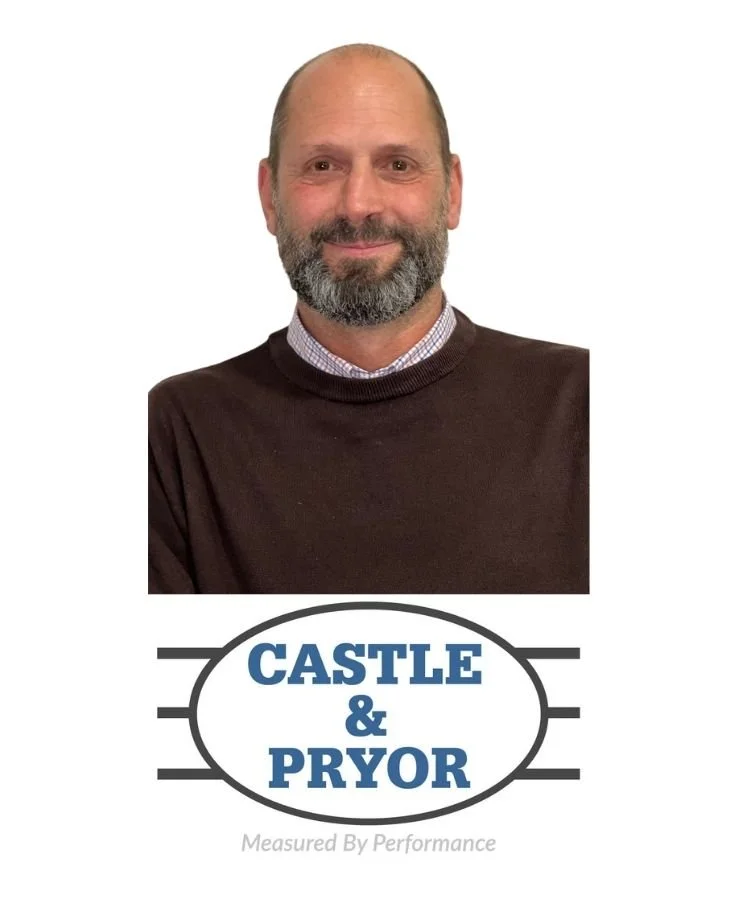 A man with a beard and mustache wearing a dark sweater and collared shirt, smiling, with a logo that says 'Castle & Pryor' and the slogan 'Measured By Performance' below.