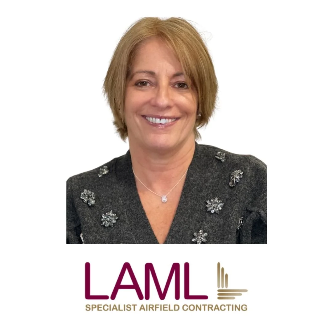 A woman with short blonde hair smiling, wearing a dark gray blazer with decorative embellishments and a silver necklace, against a white background, with the logo of LAML Specialist Airfield Contracting below her.