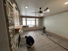 After: New drywall, paint, custom baseboard in living room area– Huntsville, Utah VCON Restoration
