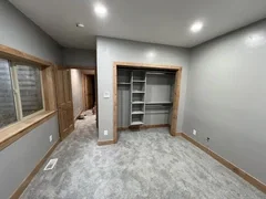 After: New carpet, paint, base boards, paint and lights in bedroom– Huntsville, Utah VCON Restoration
