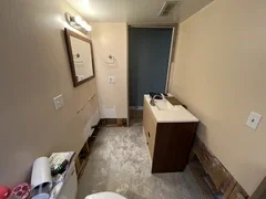 Before: Old, ruined fixtures caused by water-damage in basement bathroom in Clearfield, Utah – ready for complete rebuild by VCON Remodeling & Restoration