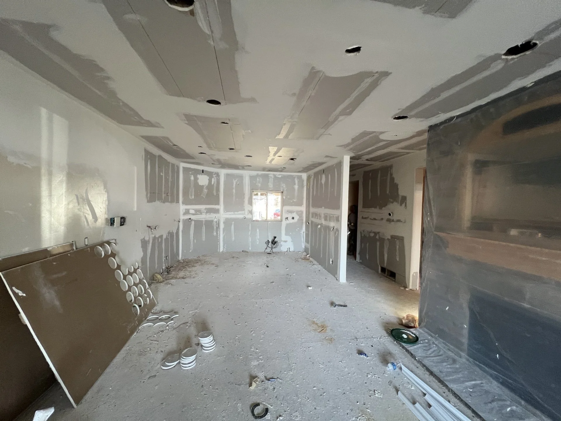 Progress: New drywall in water-damaged kitchen and living room area– Huntsville, Utah VCON Restoration
