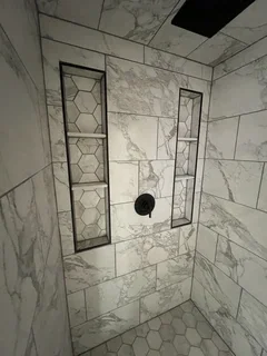 After: Finished basement bathroom with custom tile and wall niches – Clearfield, Utah remodel by VCON Remodeling & Restoration