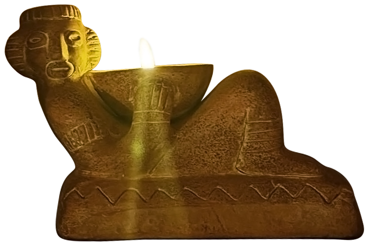 A carved wooden sculpture of a reclining figure with a human head, holding a large bowl with a candle inside it.