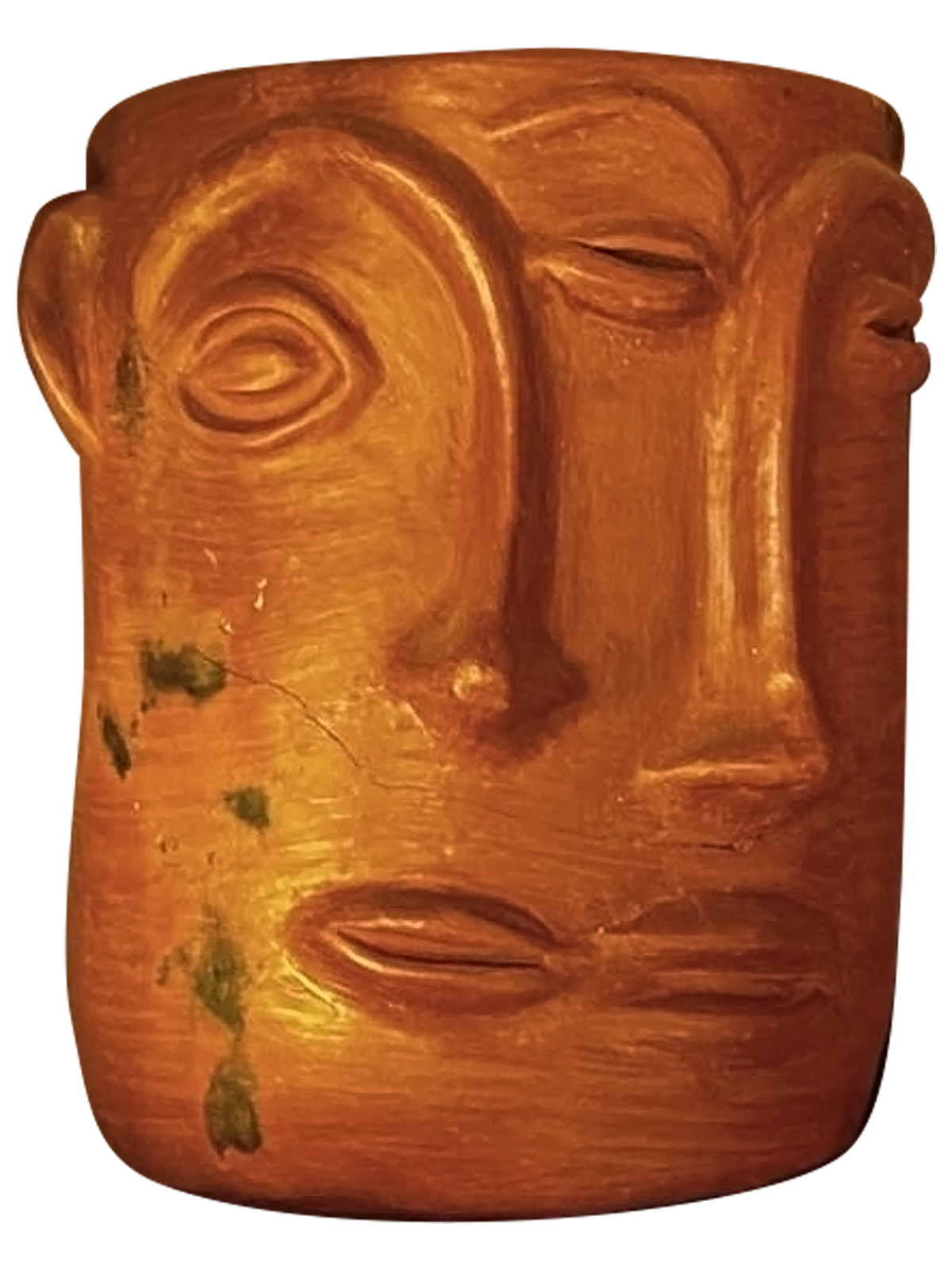 Wooden sculpture of a face with closed eyes and a prominent nose.