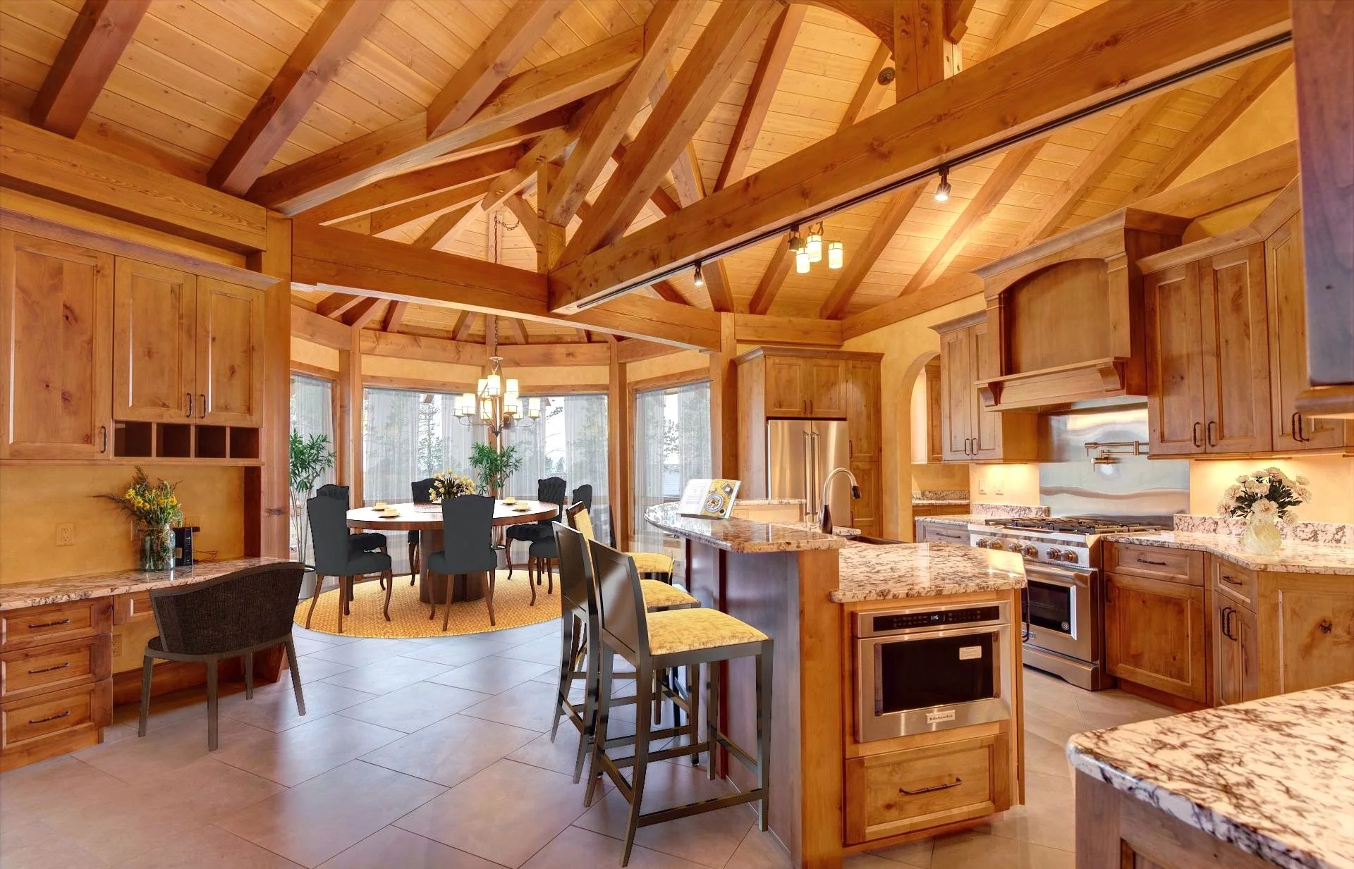 A spacious kitchen and dining area with wooden cabinets, a granite countertop, and a vaulted wooden ceiling with exposed beams. There is a round dining table with black chairs, chandeliers, large windows with curtains, potted plants, and seating at the kitchen island.