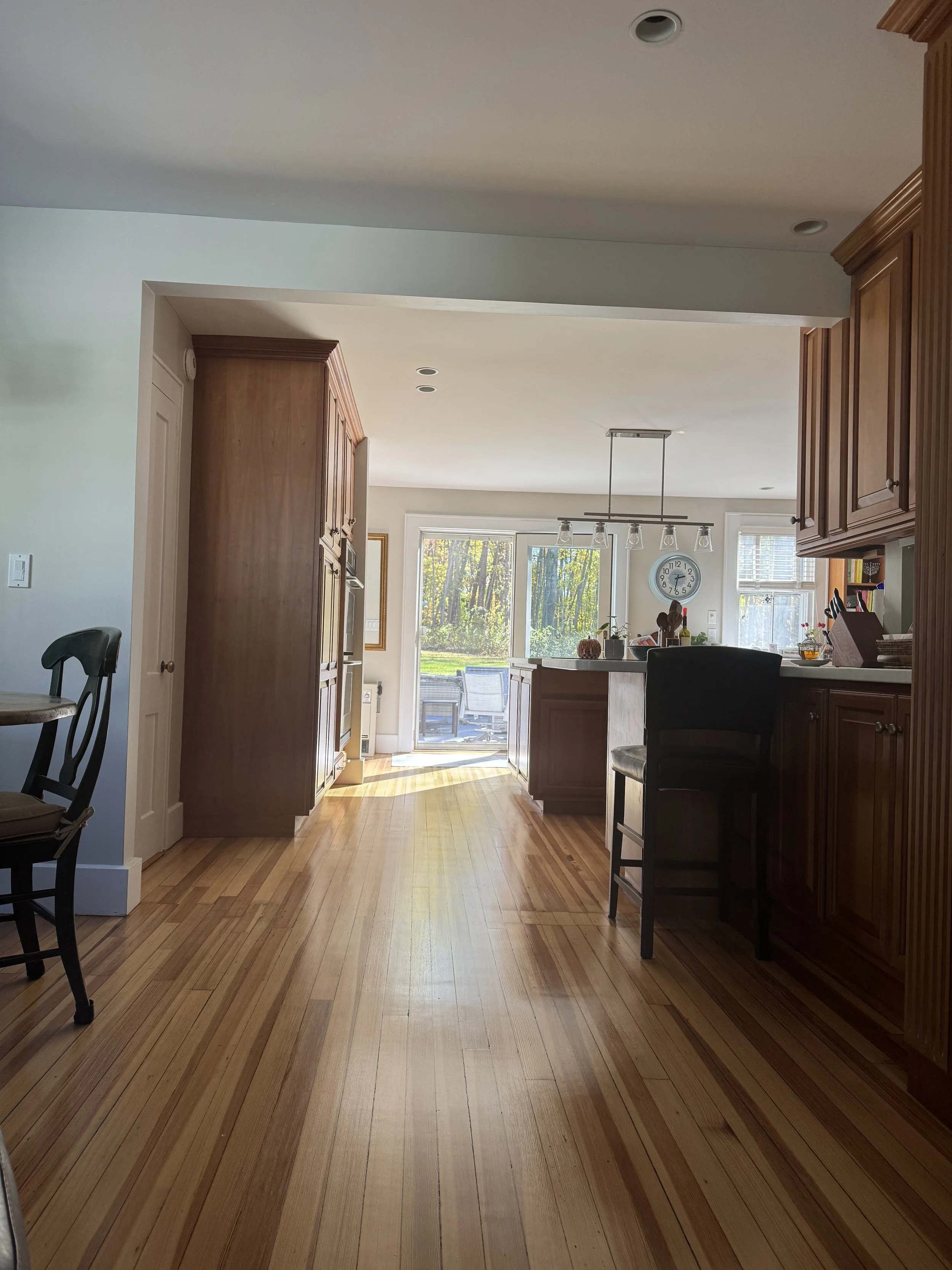 Sunlit kitchen with hardwood floors