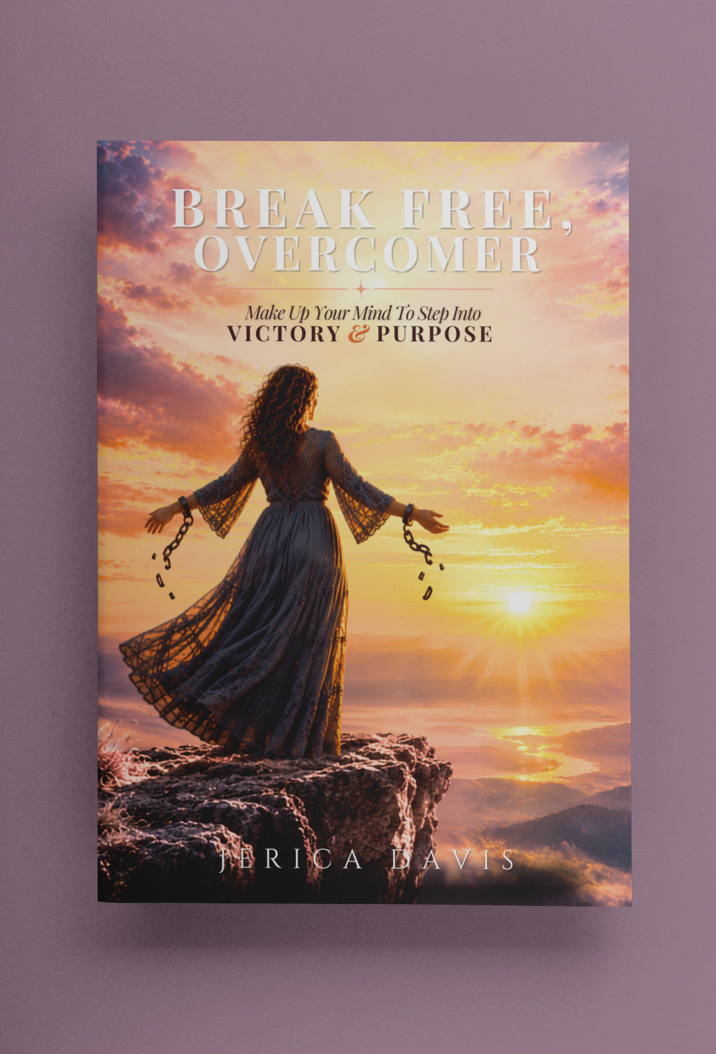 Book cover for 'Break Free, Overcomer: Make Up Your Mind to Step Into Victory and Purpose' by Jerica Davis, showing a woman breaking free of chains on a cliff at sunrise.