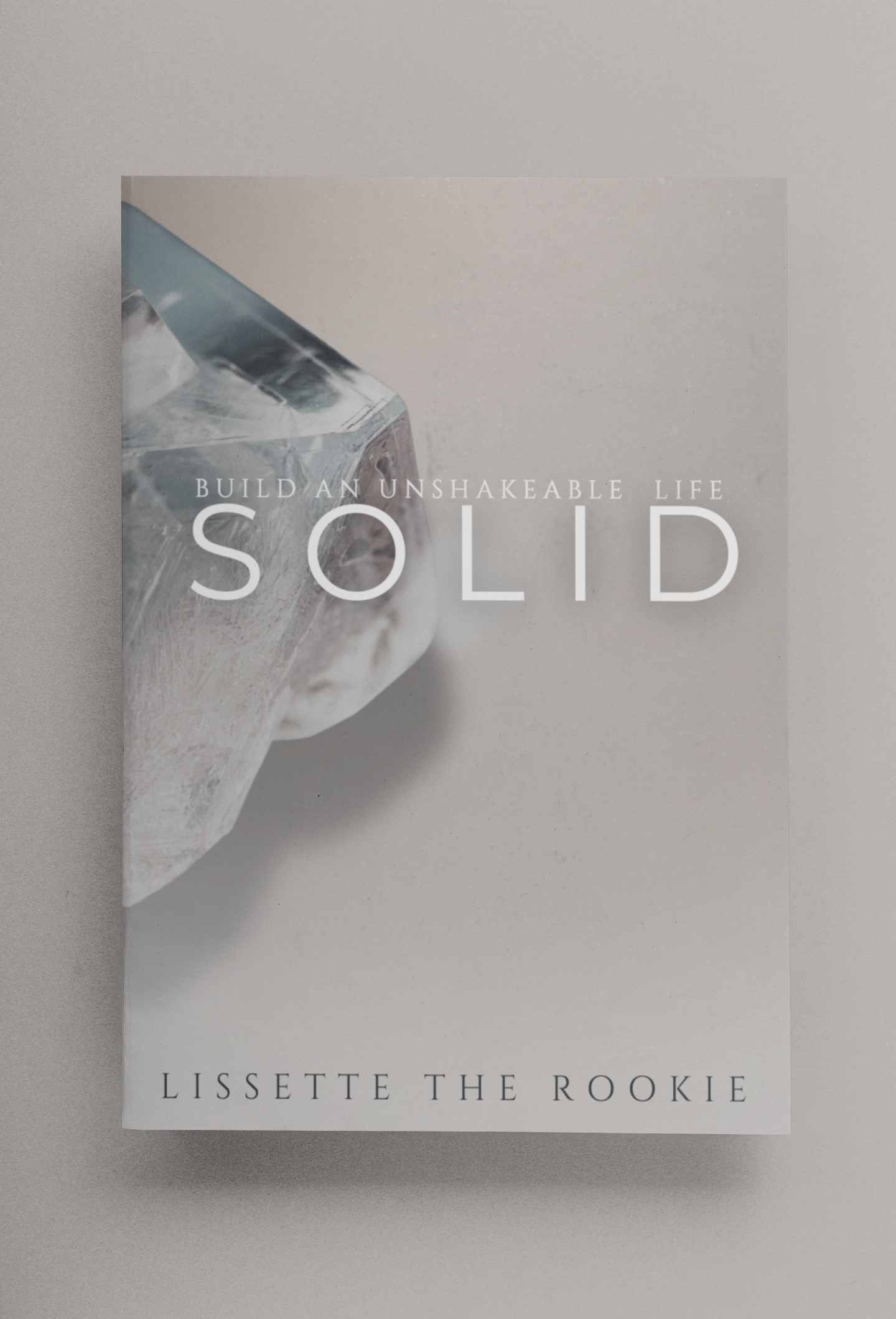 minimalistic-mockup-of-a-paperback-book-on-a-color-surface-33649-12.png
