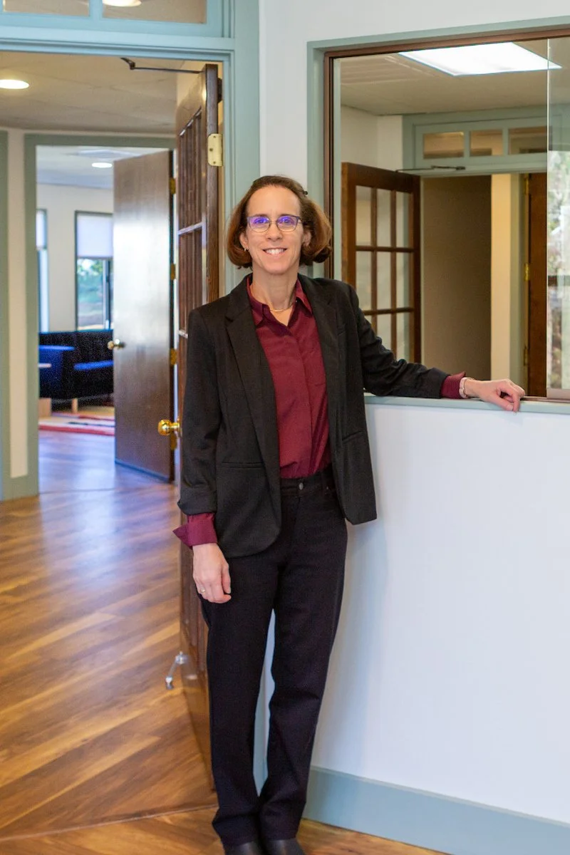 Psychiatric Services & Consultation's office manager standing in hallway ready to help