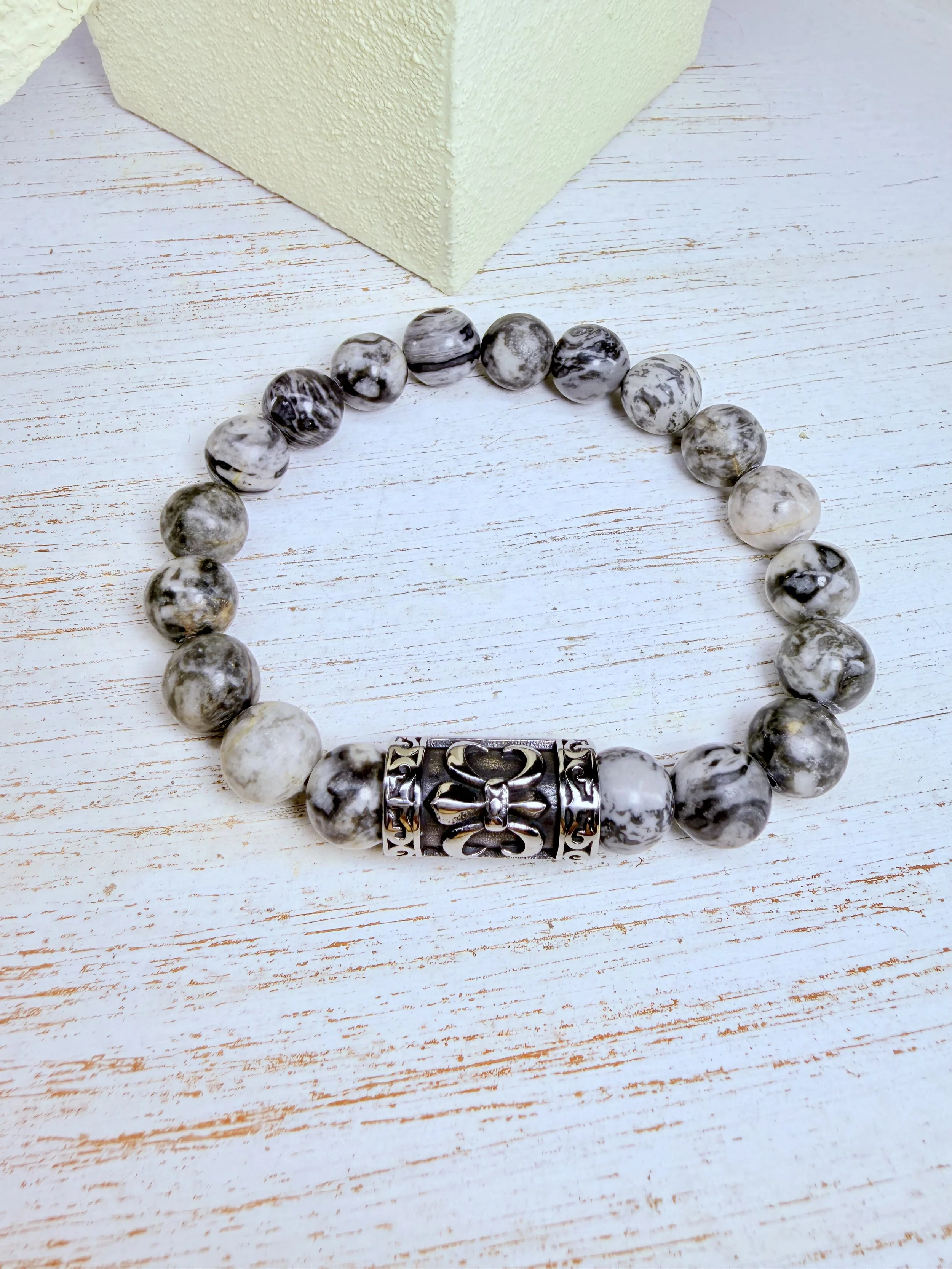 #2 10mm gray and black beads with large stainless steel Fleur-de-lis bead in the middle