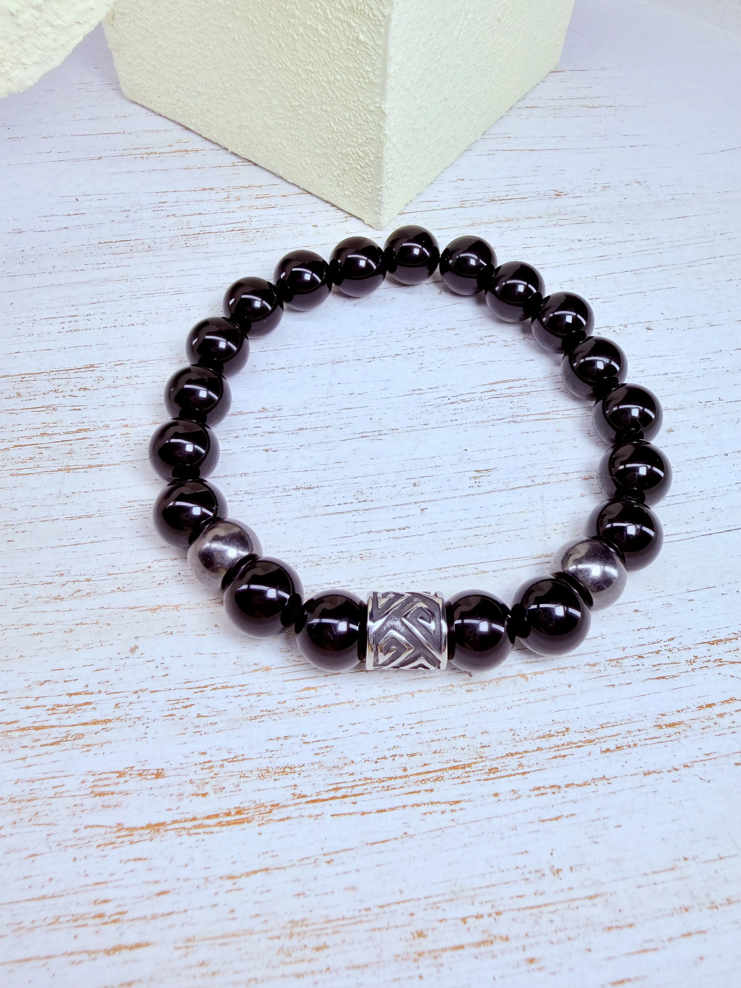#1 10mm black onyx beads/stainless steel barrel bead in the middle