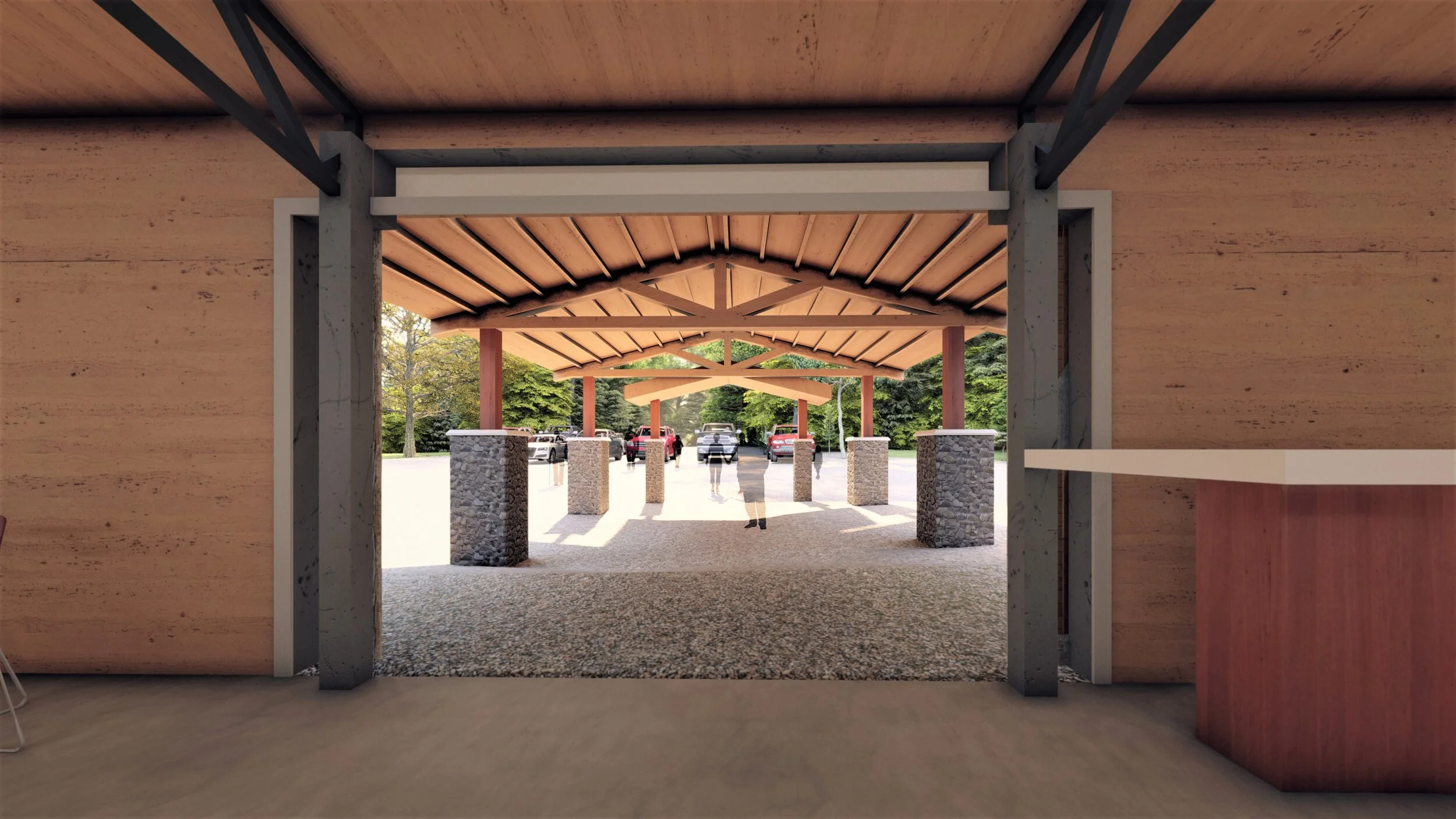 View from inside a building looking out through an open entrance to a covered outdoor area with stone columns, wooden beams, and parked cars, surrounded by trees.