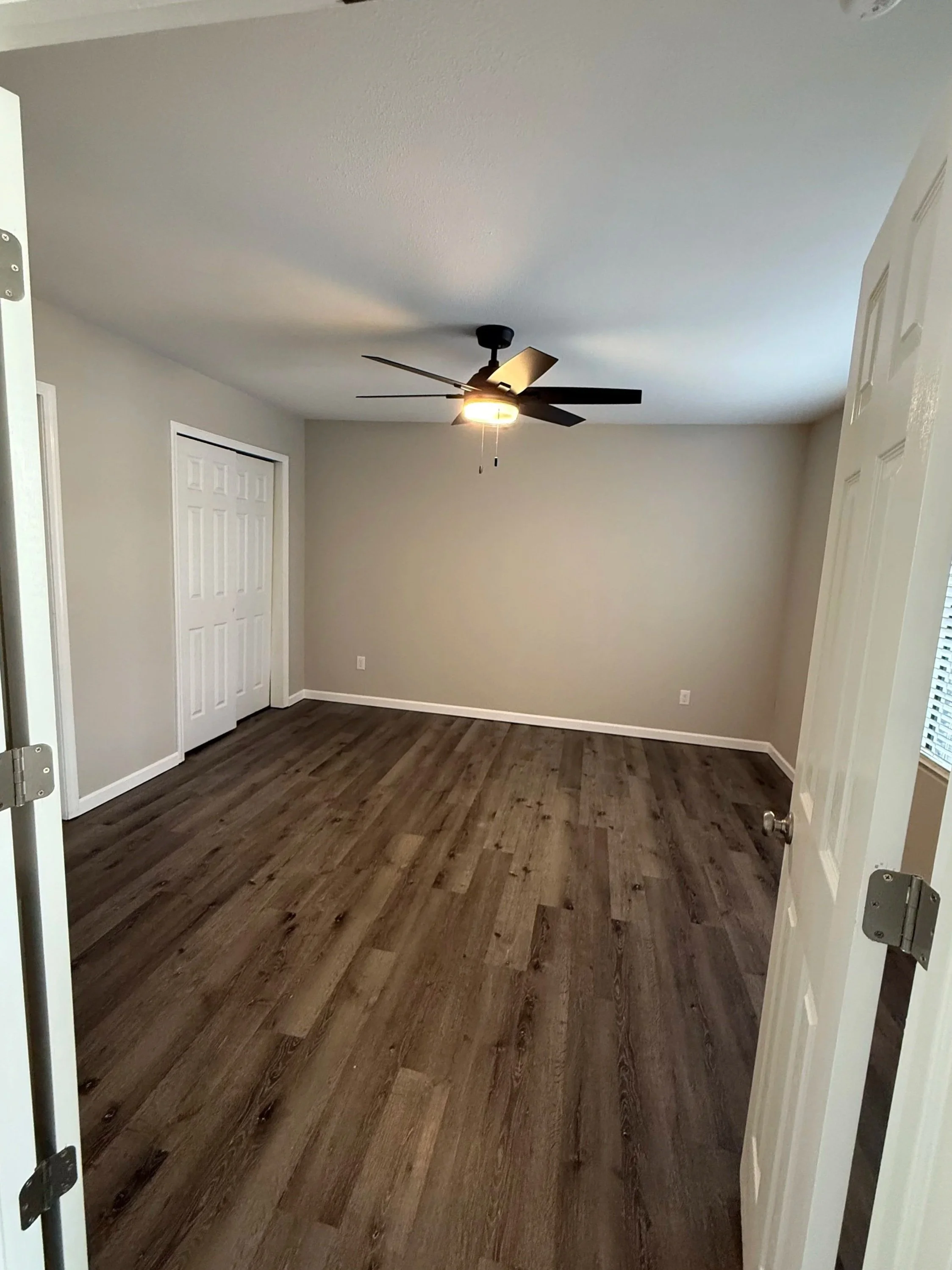 Bedroom with wood-style flooring