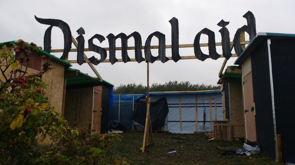 Banksy 'Dismal-aid' Sign Stolen From Calais Refugee Camp