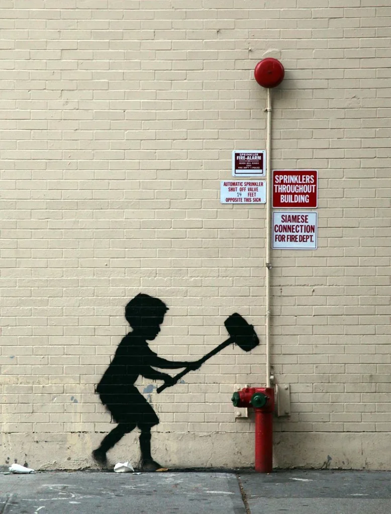 Banksy 'Hammer Boy' Graffiti In New York City