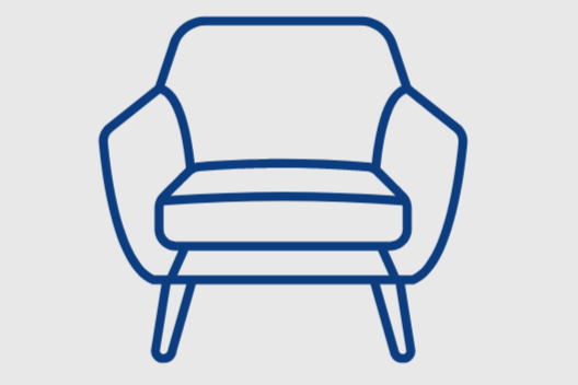 Line drawing of a modern armchair with angled legs.