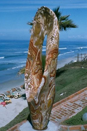 T Barny utah rhyolite sculpture on a cliff overlooking a beach
