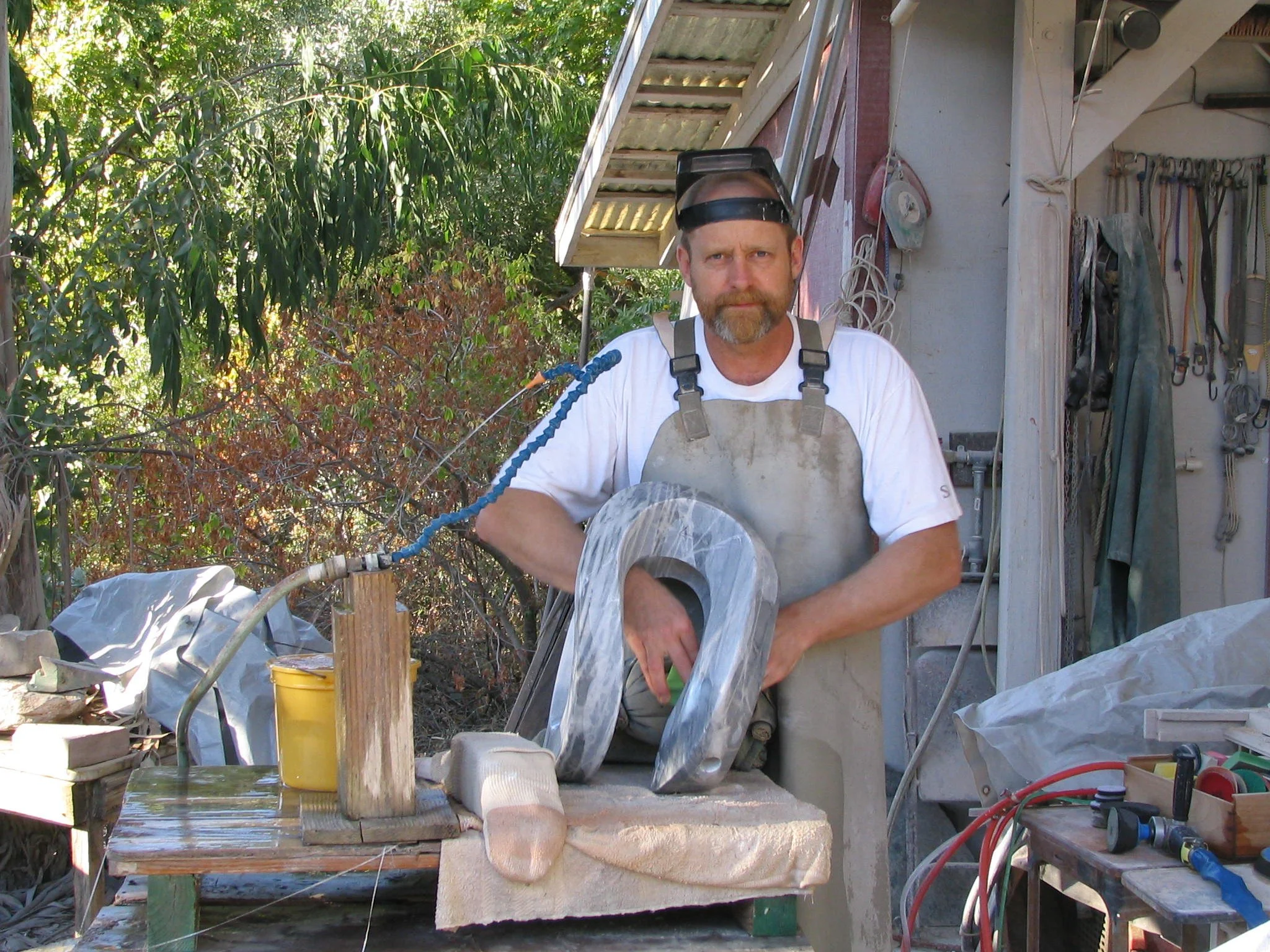 T BArny in his California studio working on a stone sculpture
