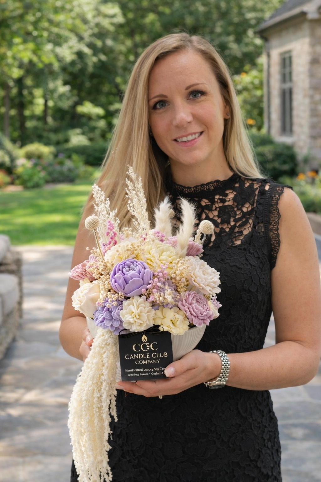 Ewelina, founder of Candle Club Company, holding handmade soy candle bouquet in Farmington Connecticut, luxury candle brand