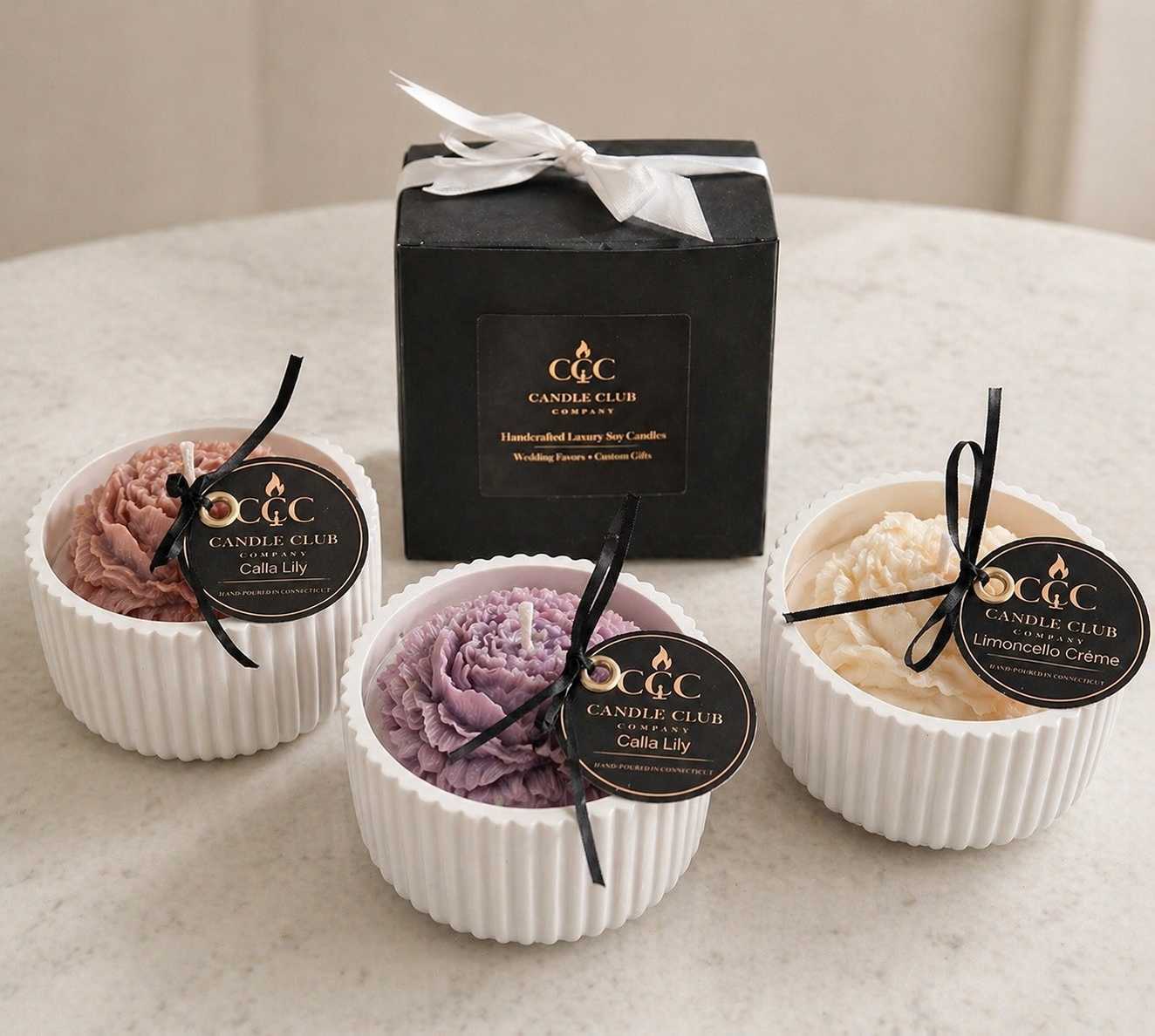 Candle Club Company floral candle collection with gift box, showing blush pink, ivory crème, and lavender mauve color options.