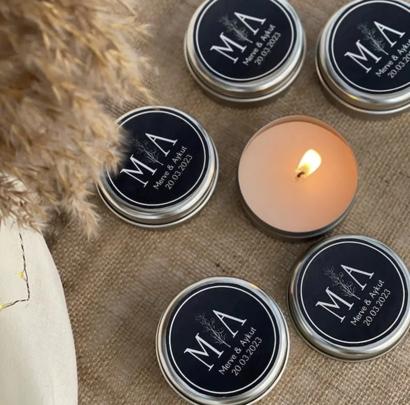 Hand-poured soy candles in black metal tins arranged in a circle, bridal shower,  Candle Club Company Farmington CT.