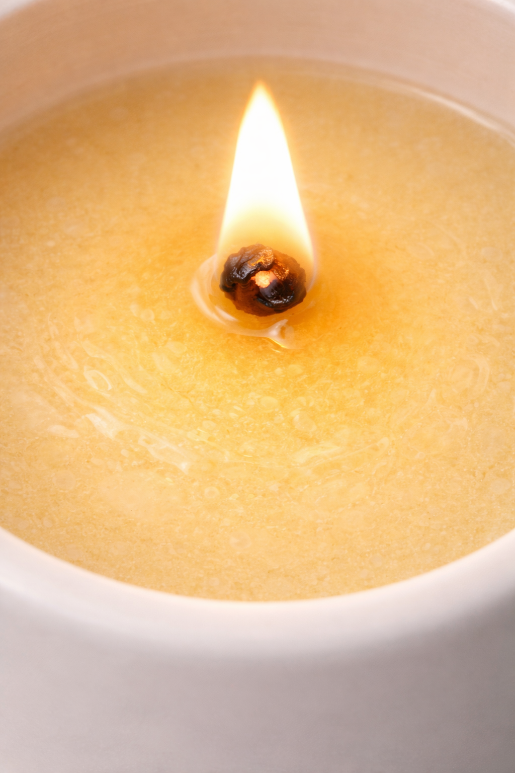 Close-up candle flame on soy wax clean burning luxury candle texture detail
