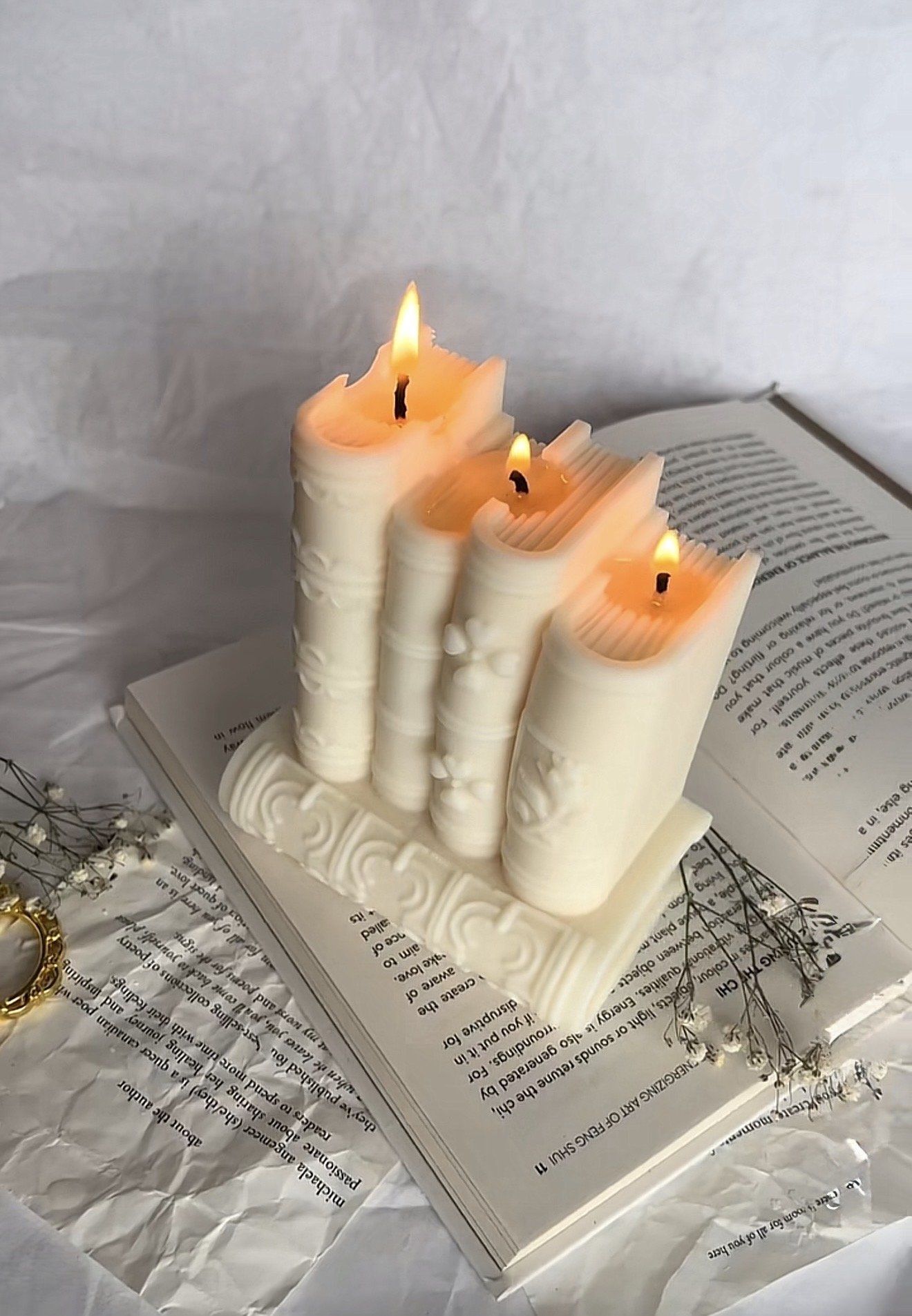 The Signature Book Candle lit sculptural candle inspired by books and artistic home décor