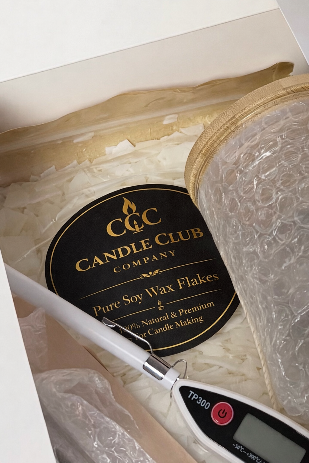 Open DIY candle making kit showing soy wax flakes and tools – Candle Club Company