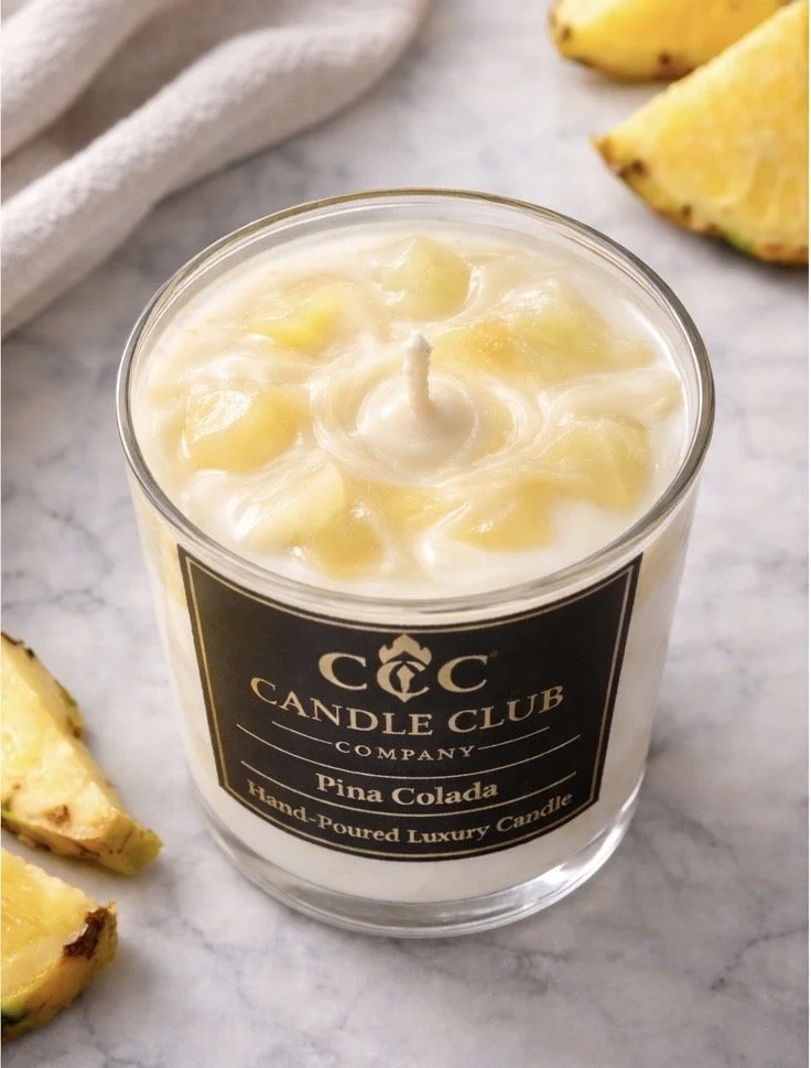 Top view of luxury Piña Colada soy candle with creamy textured wax and pineapple accents, clean-burning cotton wick