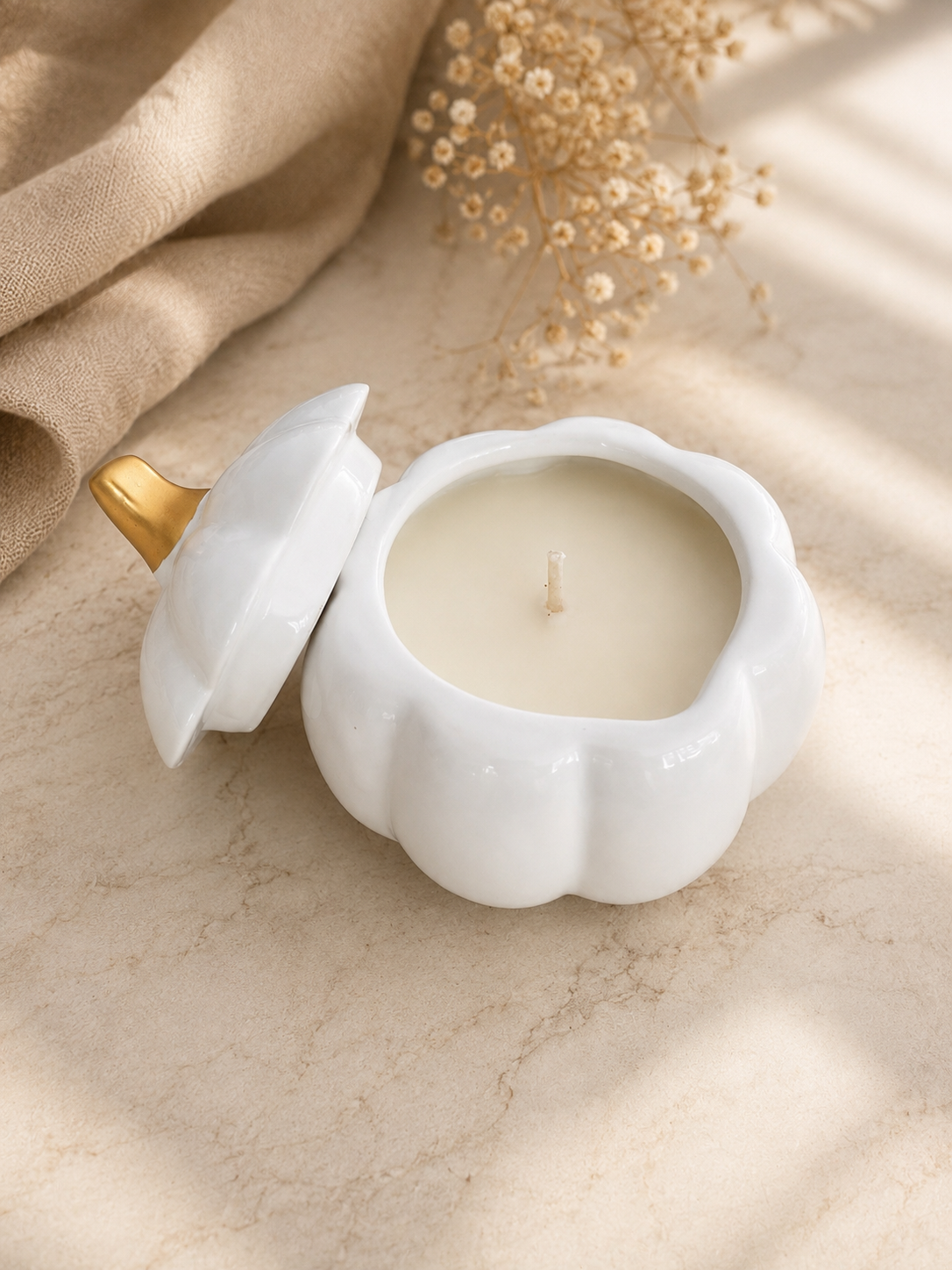 Open Golden Harvest Pumpkin 8 oz soy candle in white ceramic vessel showing hand-poured soy wax and removable gold-stems lid, made in Farmington, Connecticut.